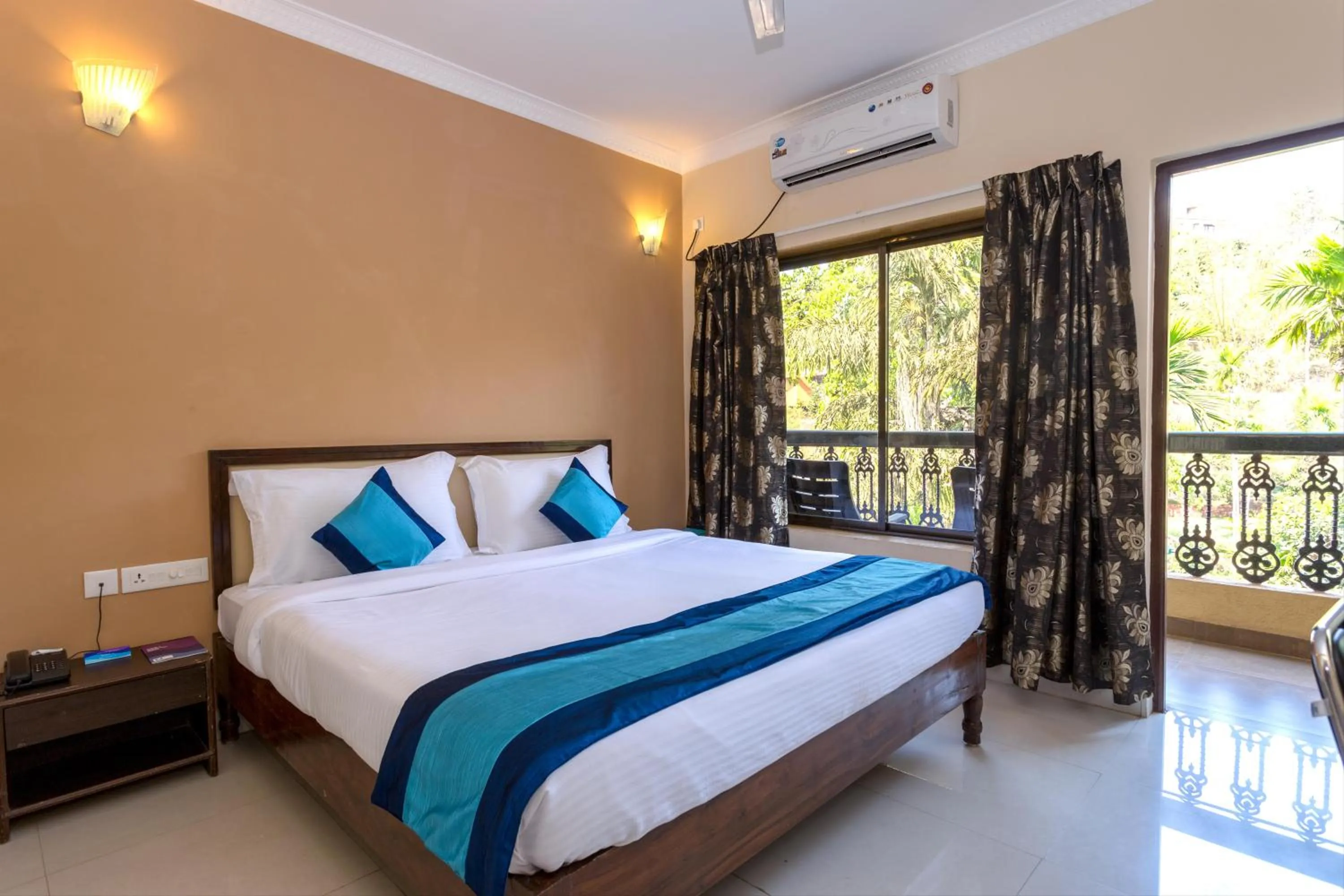 Bed in Rendezvous Beach Resort Panjim