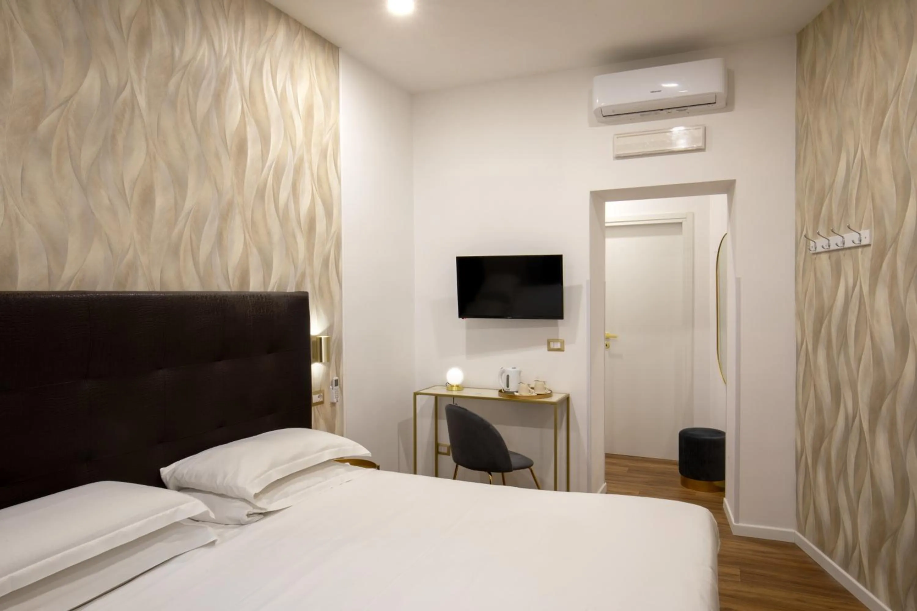 Bed in Amalia Suites by Remember Rome