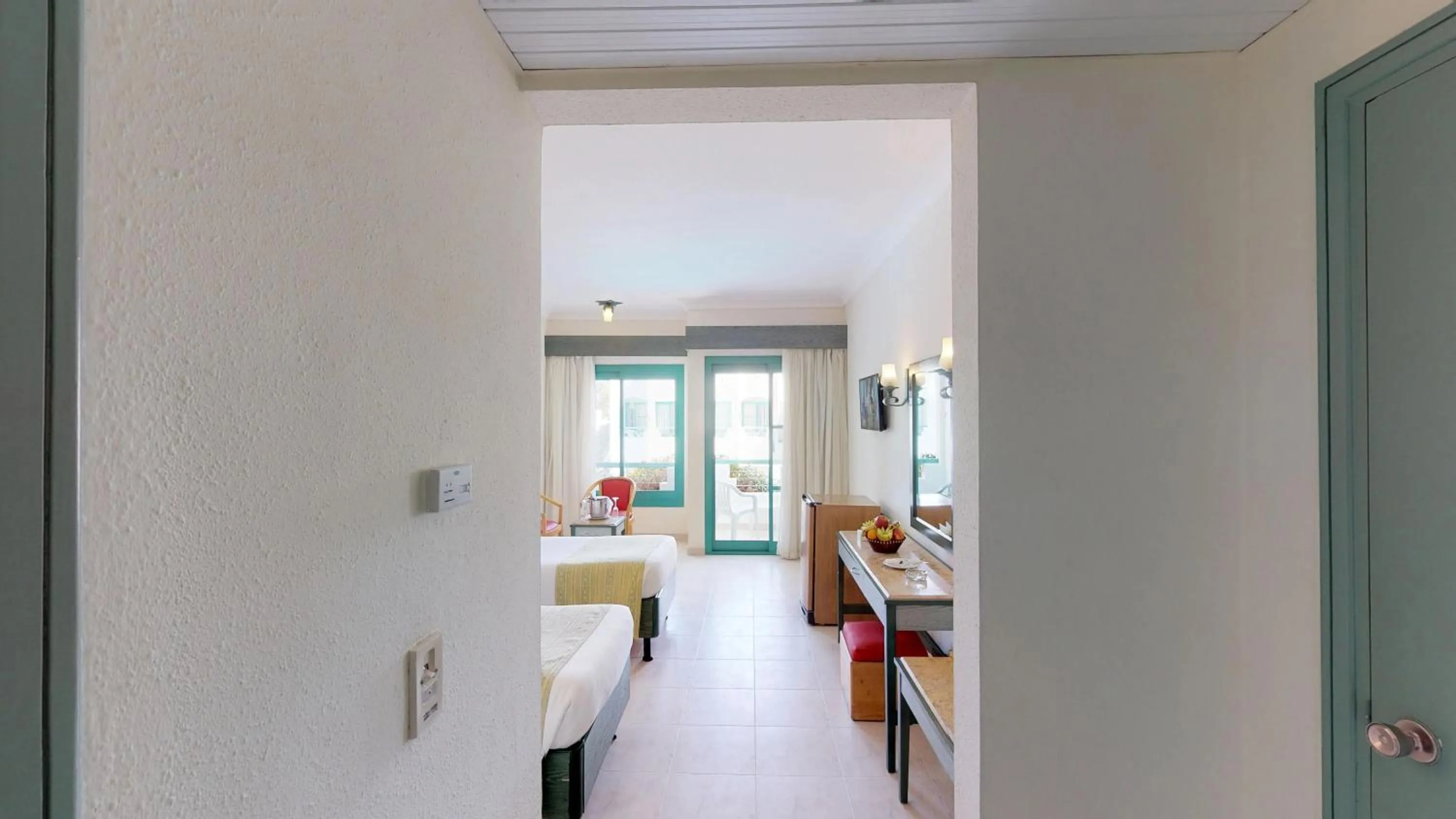 Seating area, Bed in Falcon Hills Hotel