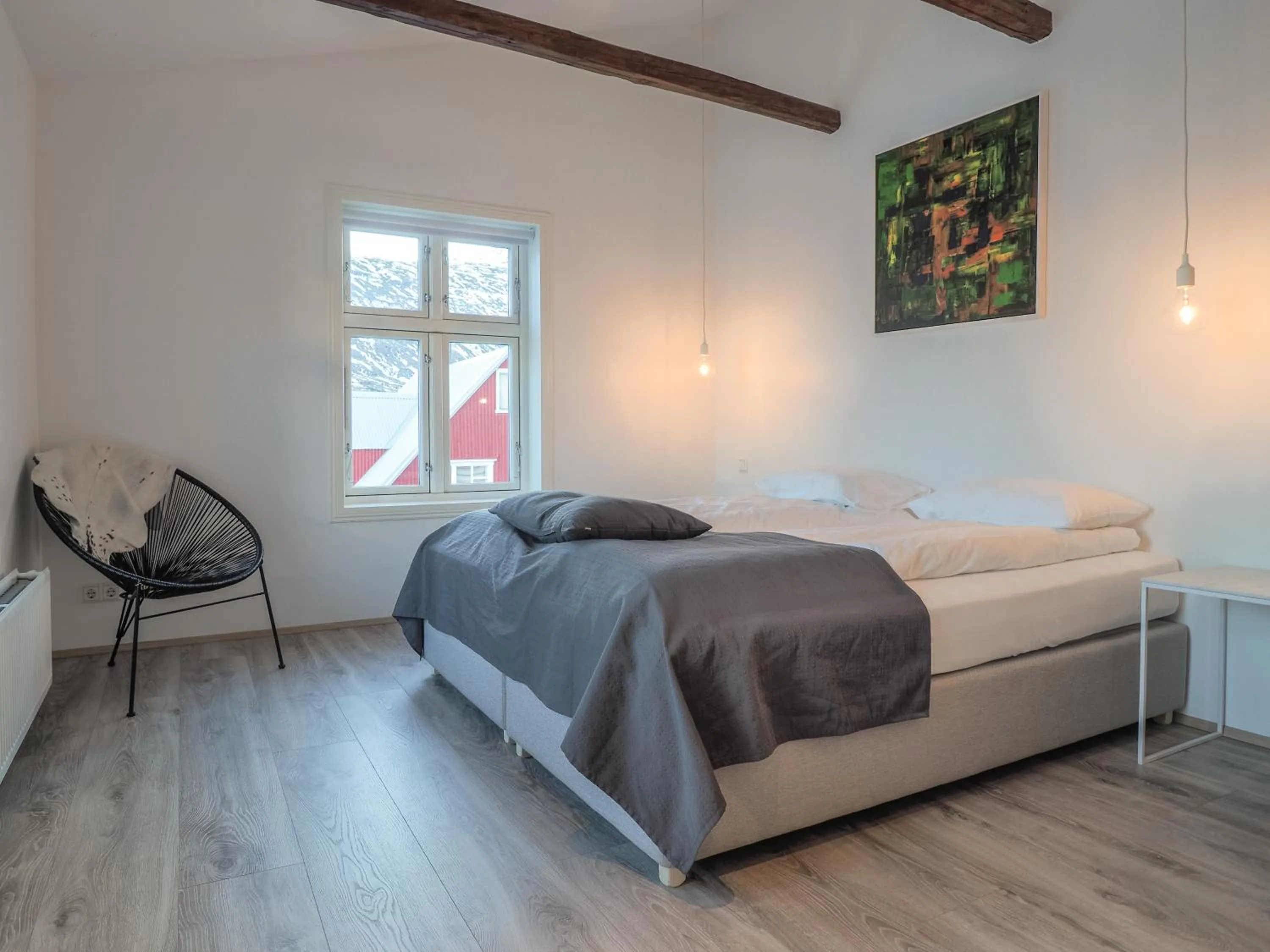 Seating area, Bed in Við Lónið Guesthouse