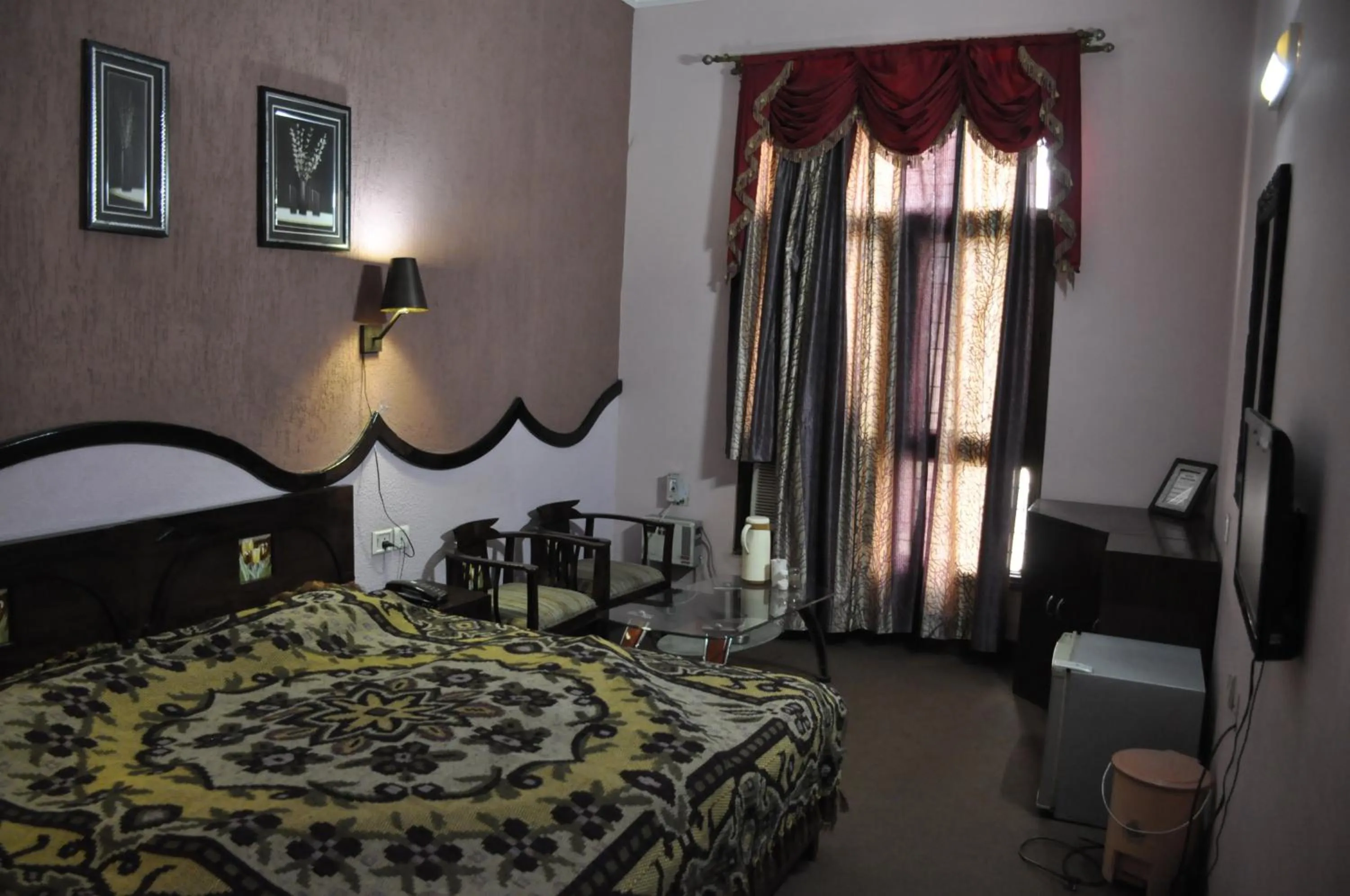 Bed in Hotel Pratiksha