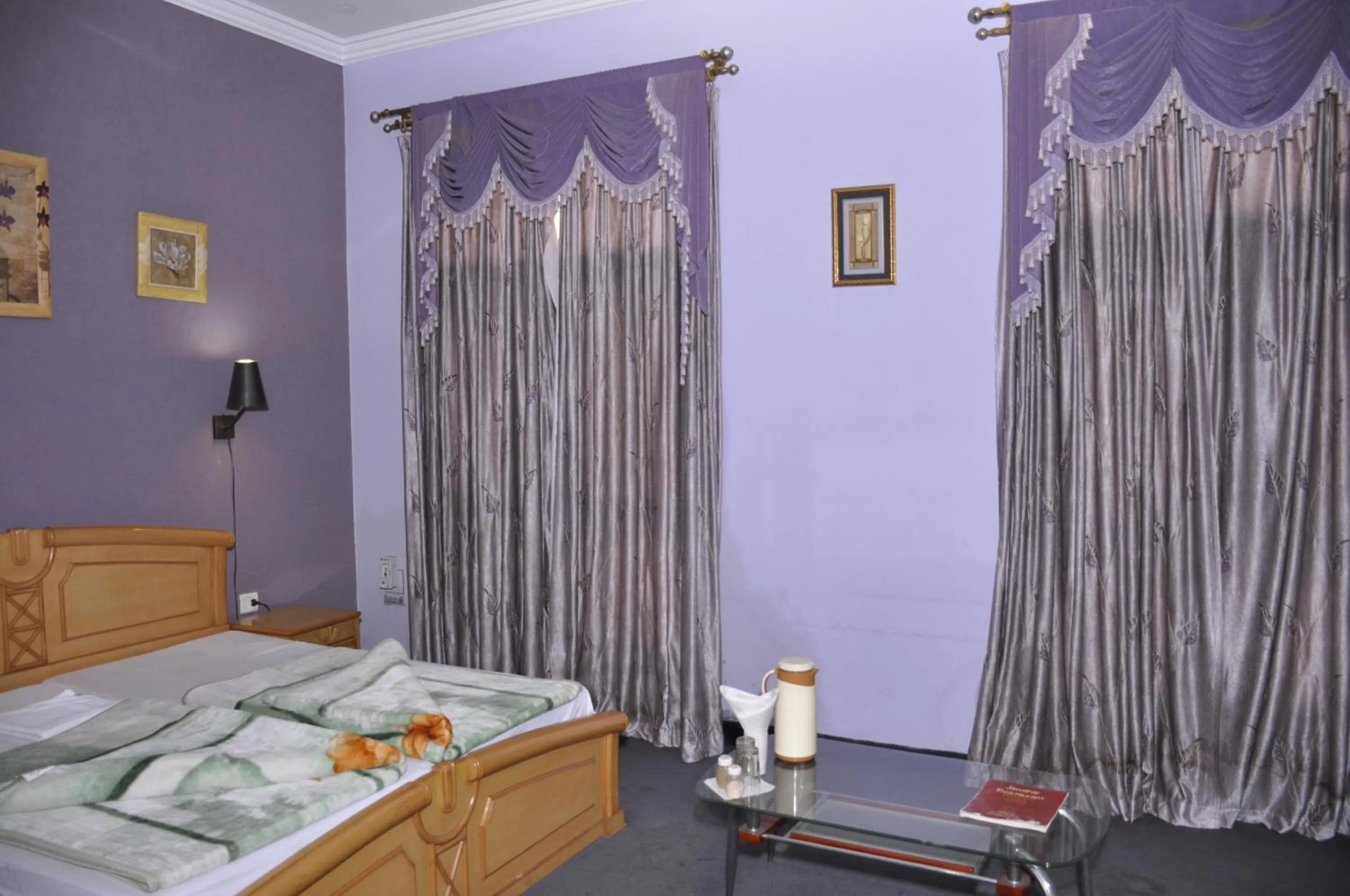 Bed in Hotel Pratiksha