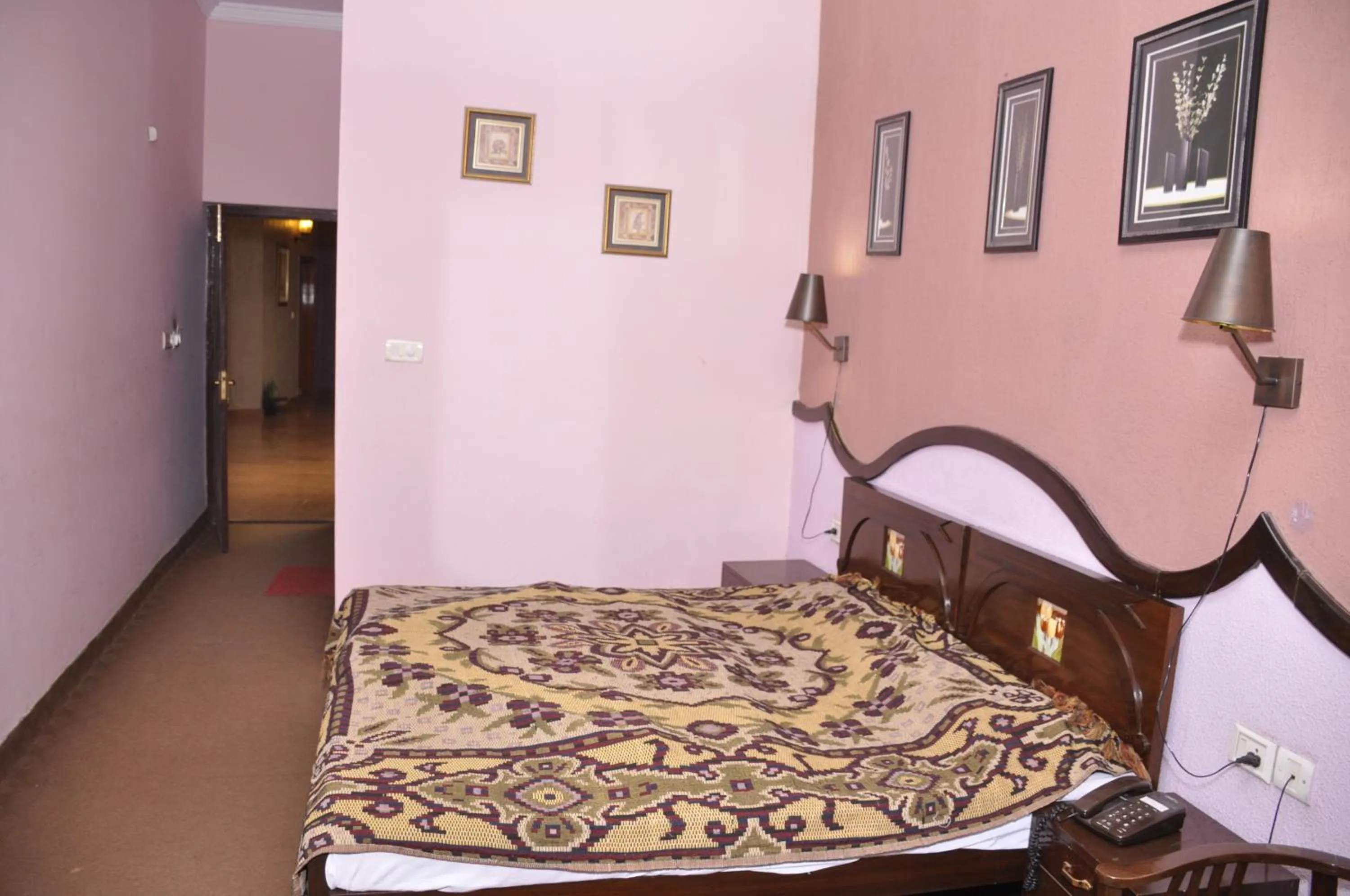 Bed in Hotel Pratiksha