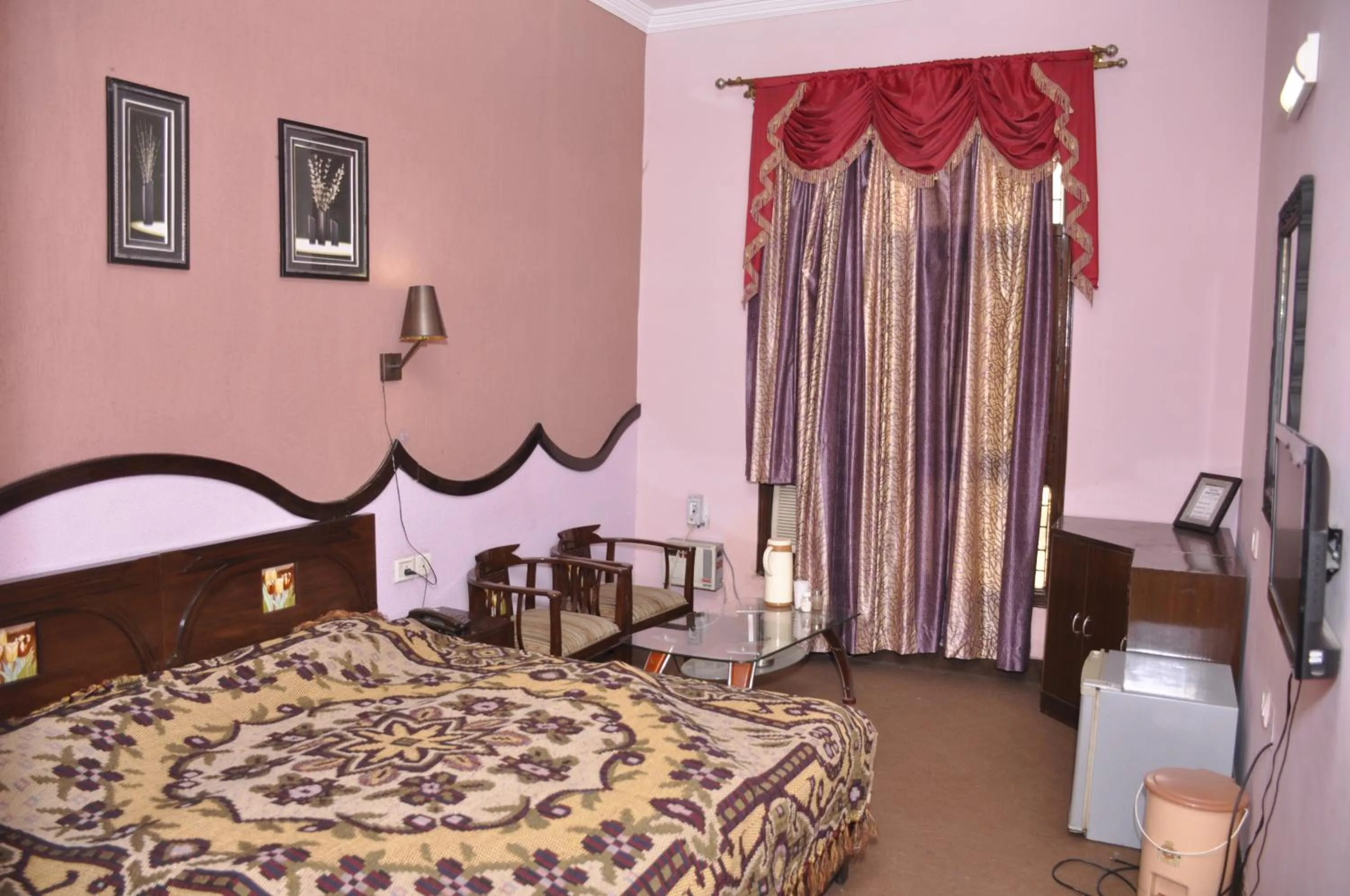 Bed in Hotel Pratiksha