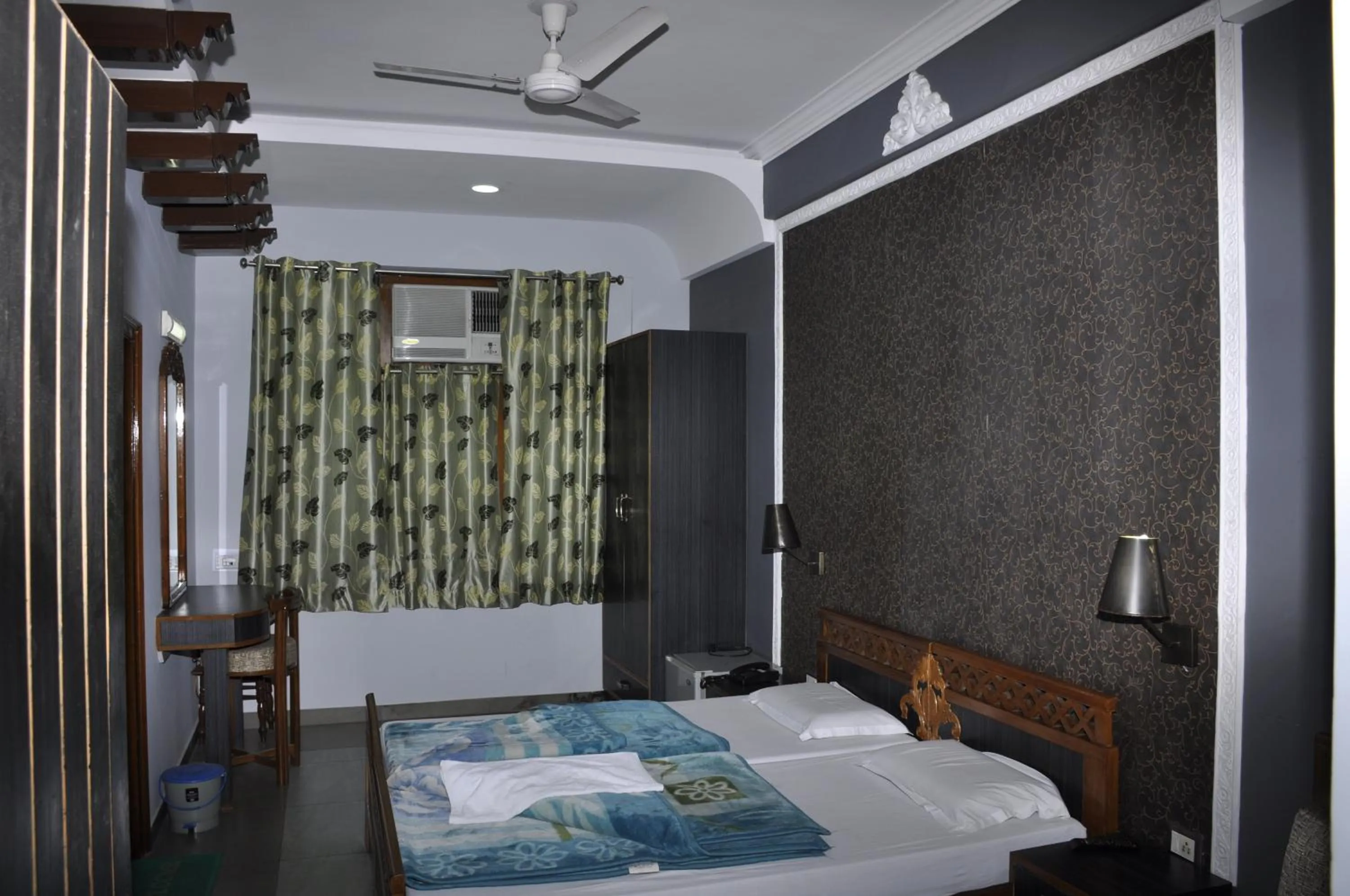 Bed in Hotel Pratiksha