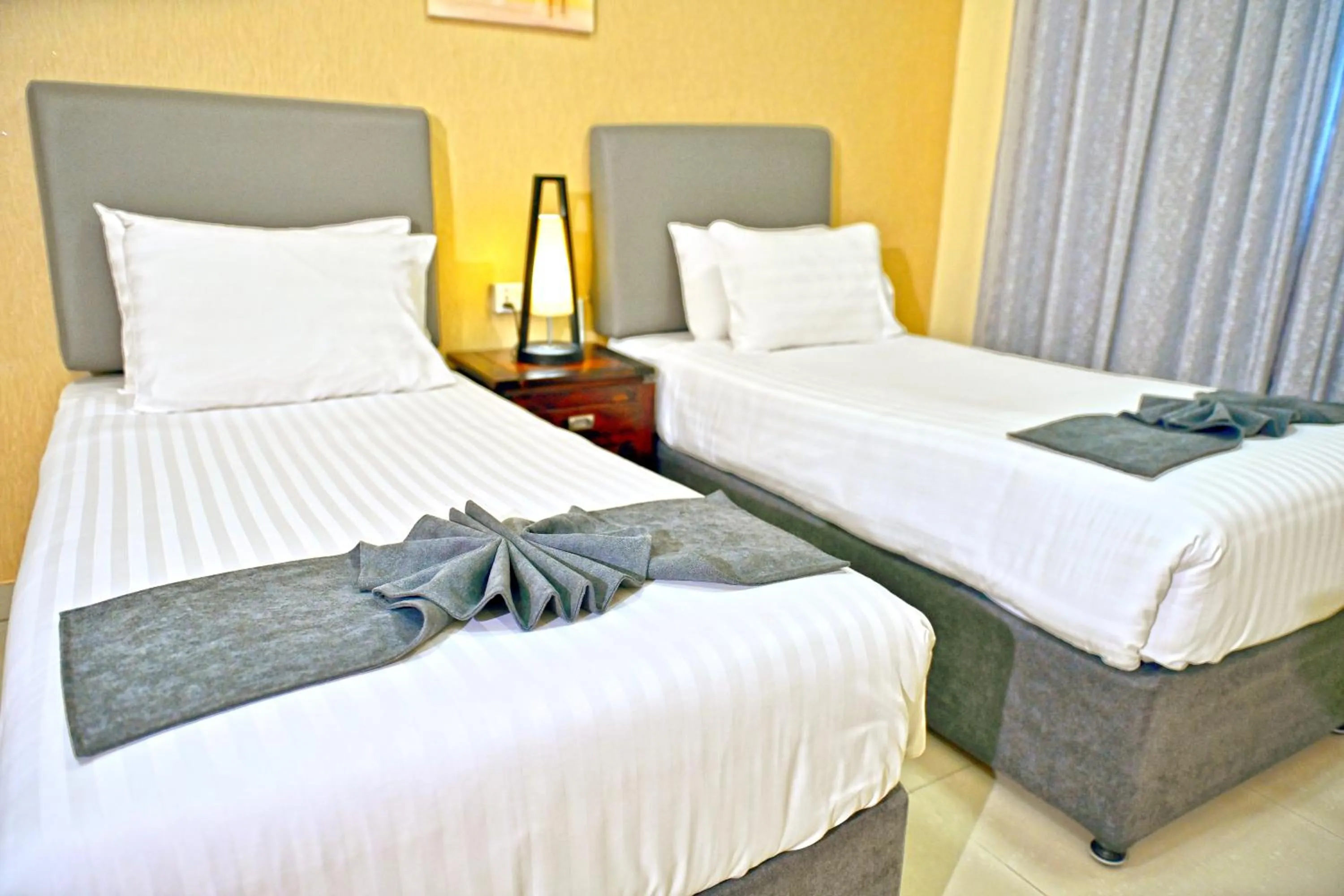 Bed in Ewan Tower Hotel Apartments