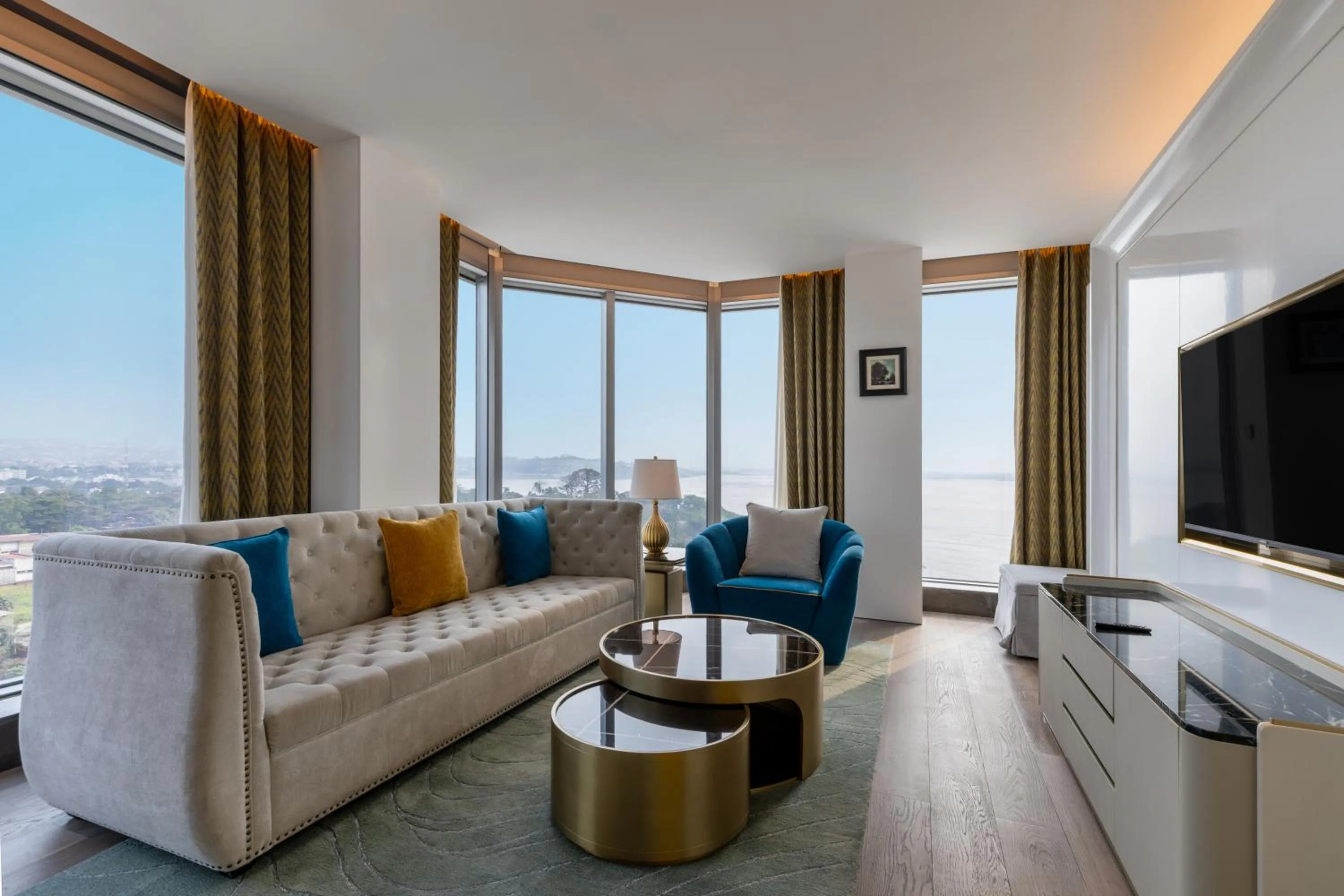 Communal lounge/ TV room in Fleuve Congo Hotel By Blazon Hotels