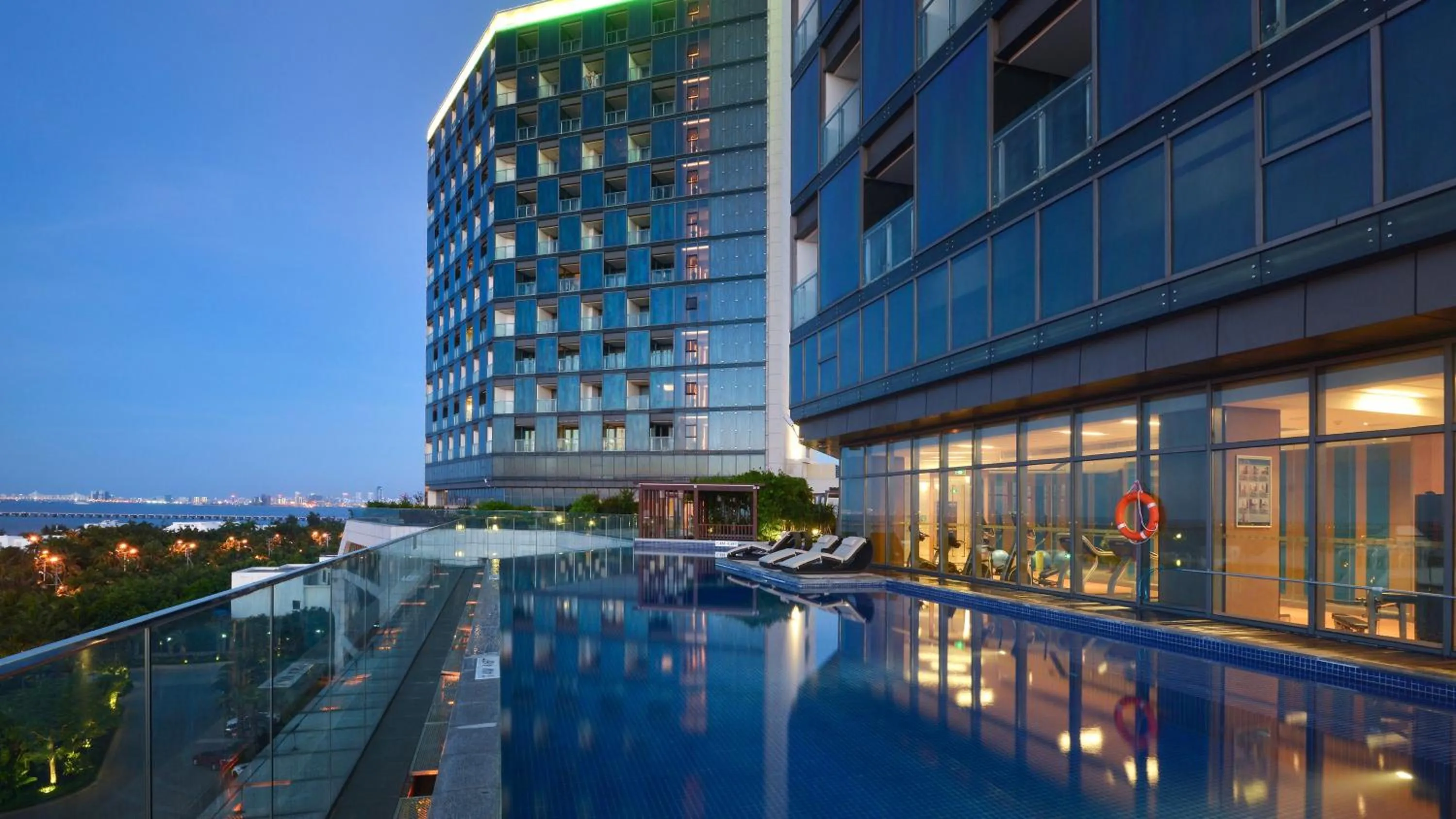 Swimming pool in Holiday Inn Haikou West Coast by IHG
