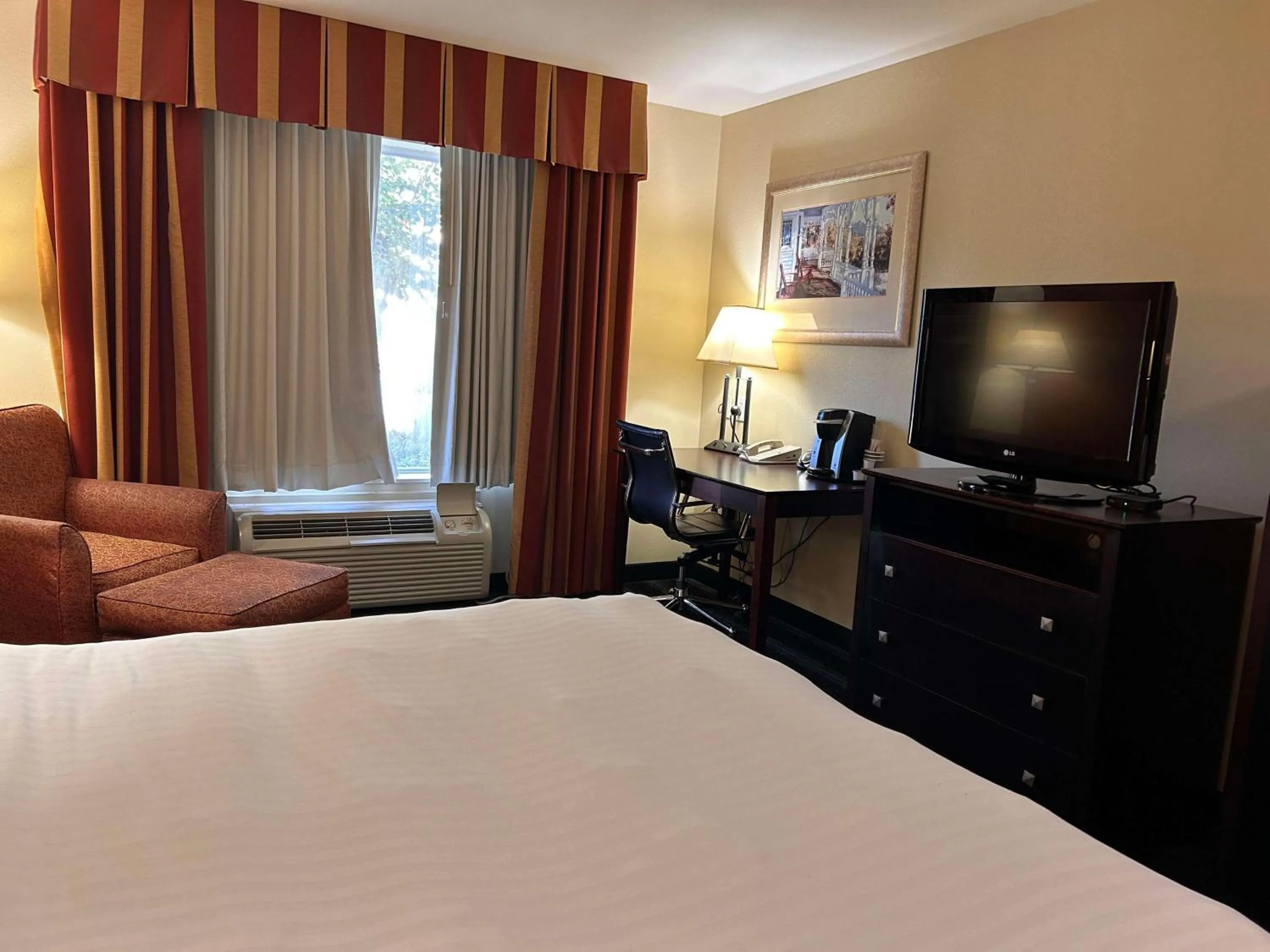 Bedroom, Bed in Express Inn Leesville Ft Johnson, SureStay Collection by Best Western