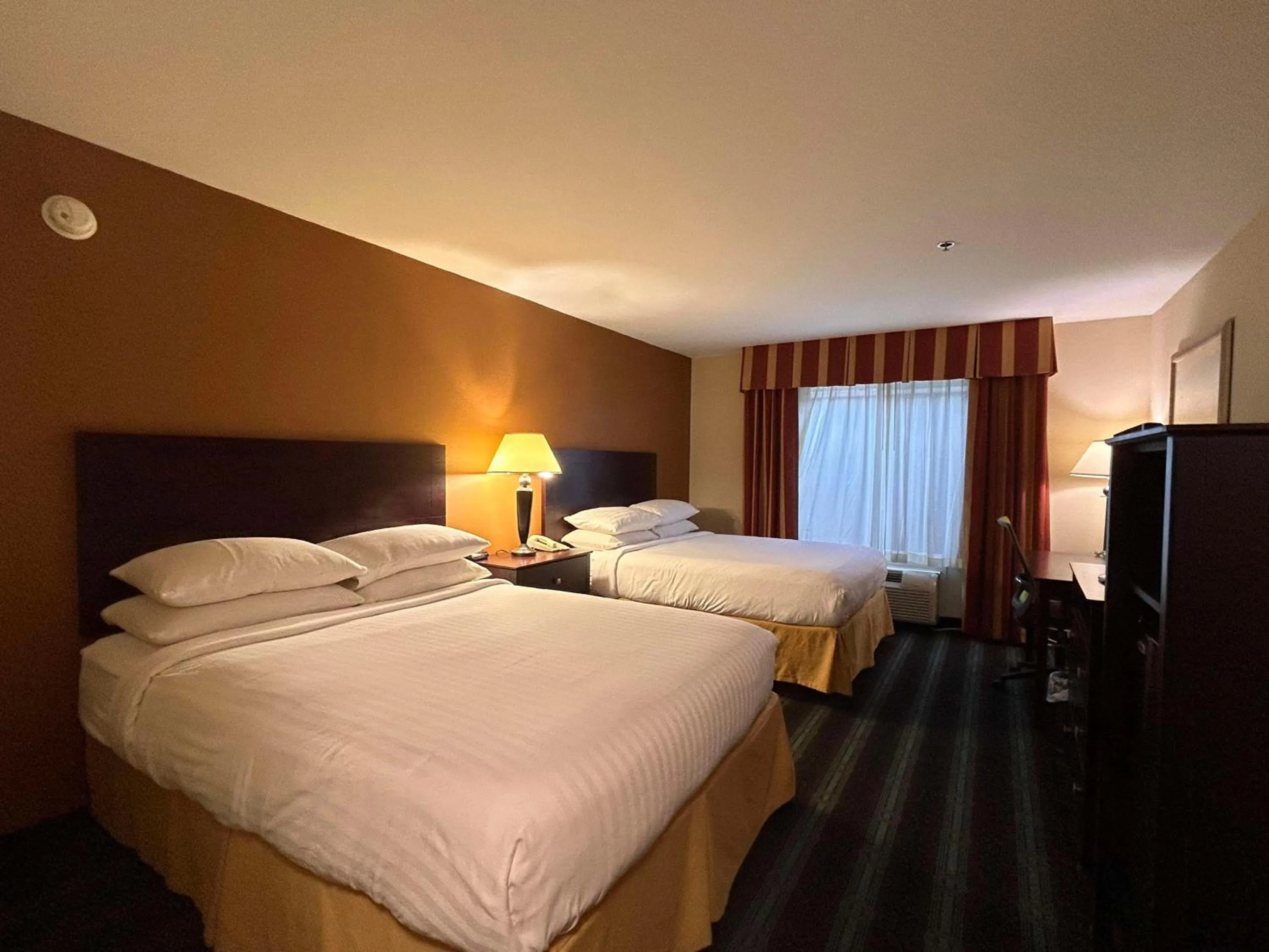 Bedroom, Bed in Express Inn Leesville Ft Johnson, SureStay Collection by Best Western