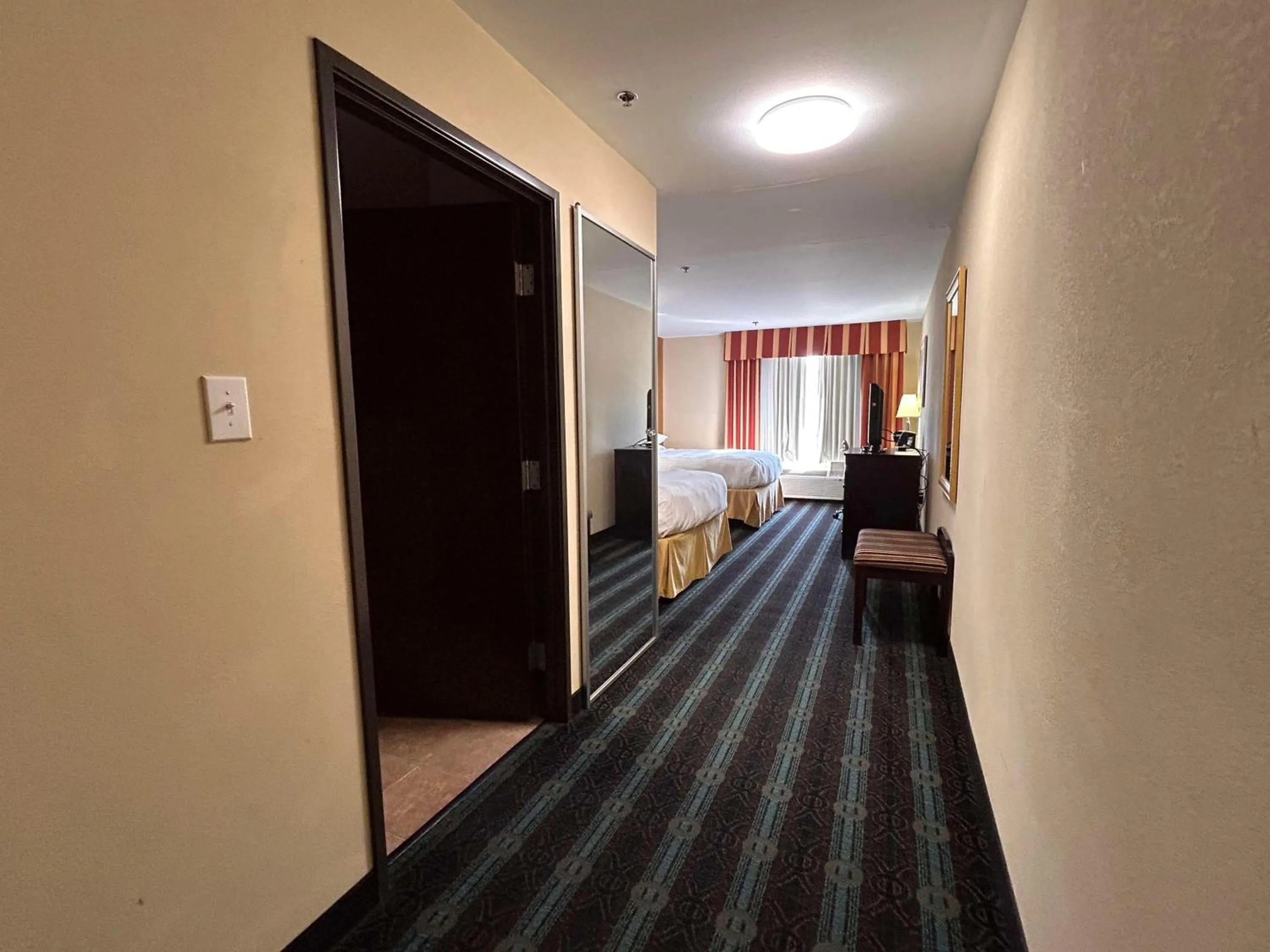 Bedroom, Bed in Express Inn Leesville Ft Johnson, SureStay Collection by Best Western