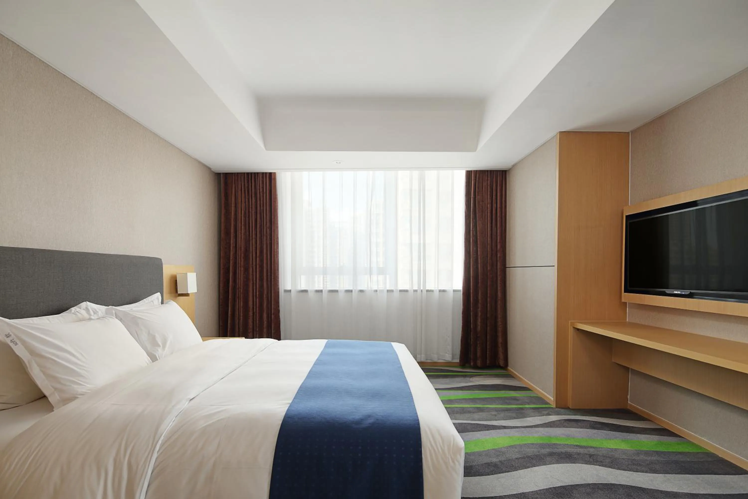 Bed in Holiday Inn Express Jinan High-Tech Zone by IHG