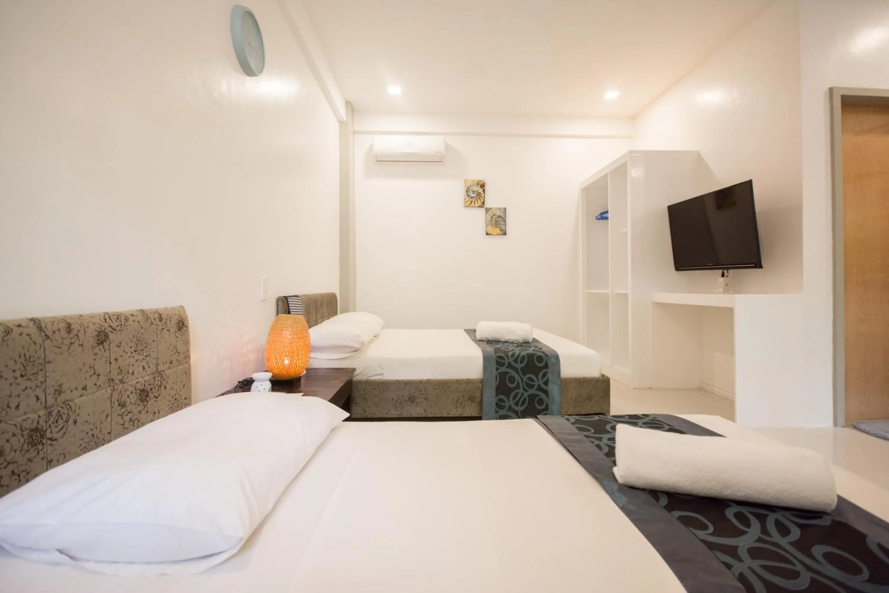 Bed in Everrich Boutique Resort Boracay