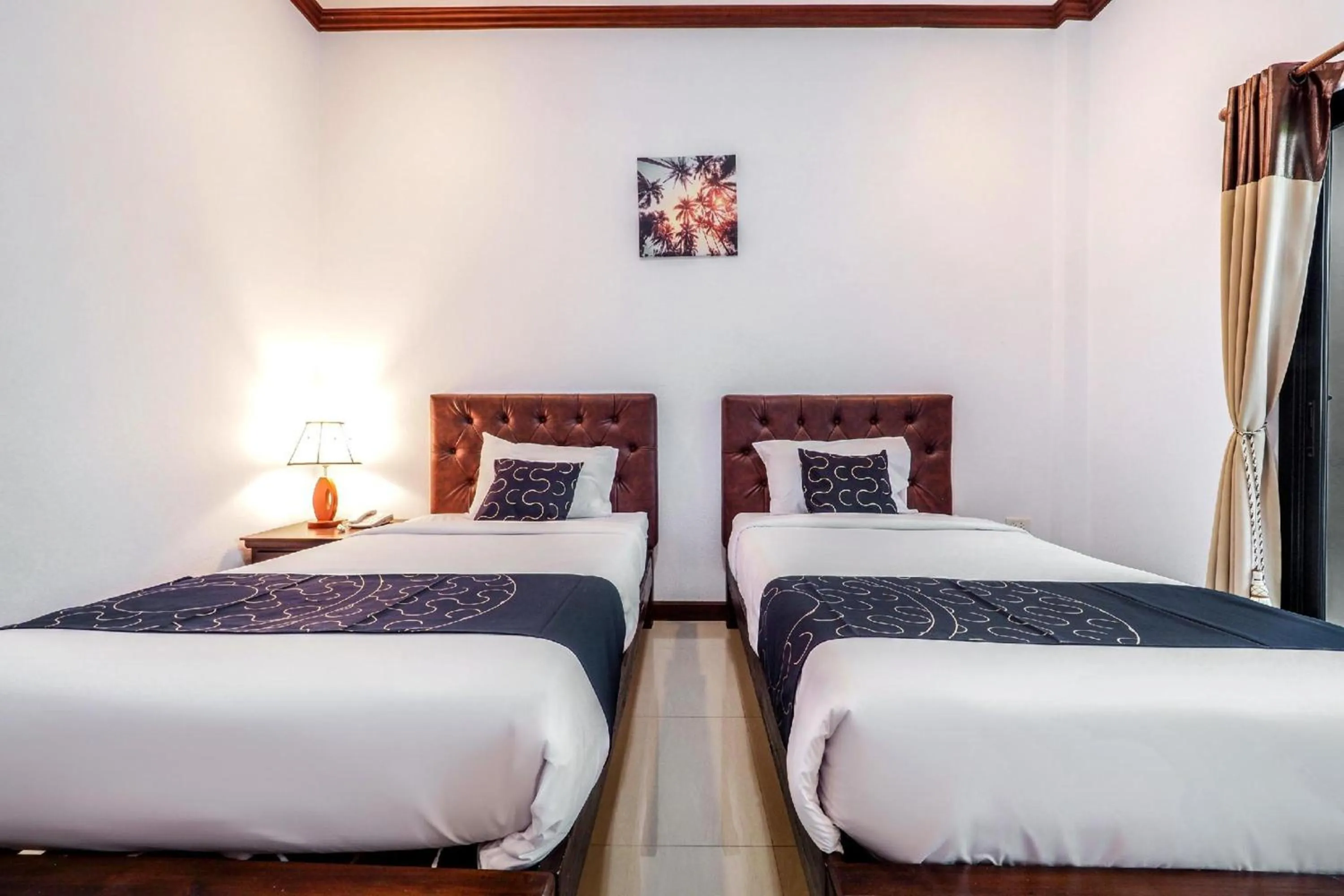 Photo of the whole room in Capital O 727 Be One Resort