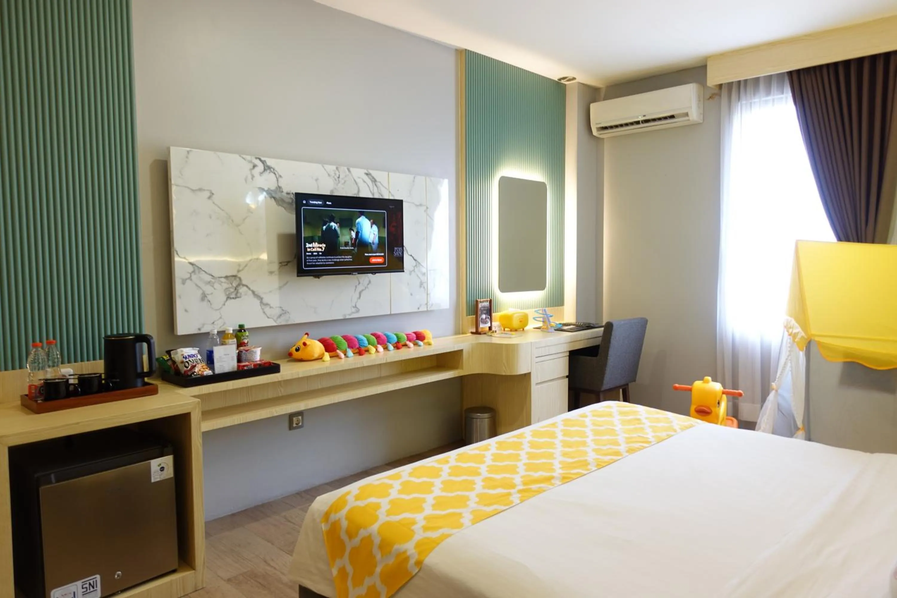 Bed in Grand Kangen Hotel Urip Sumoharjo