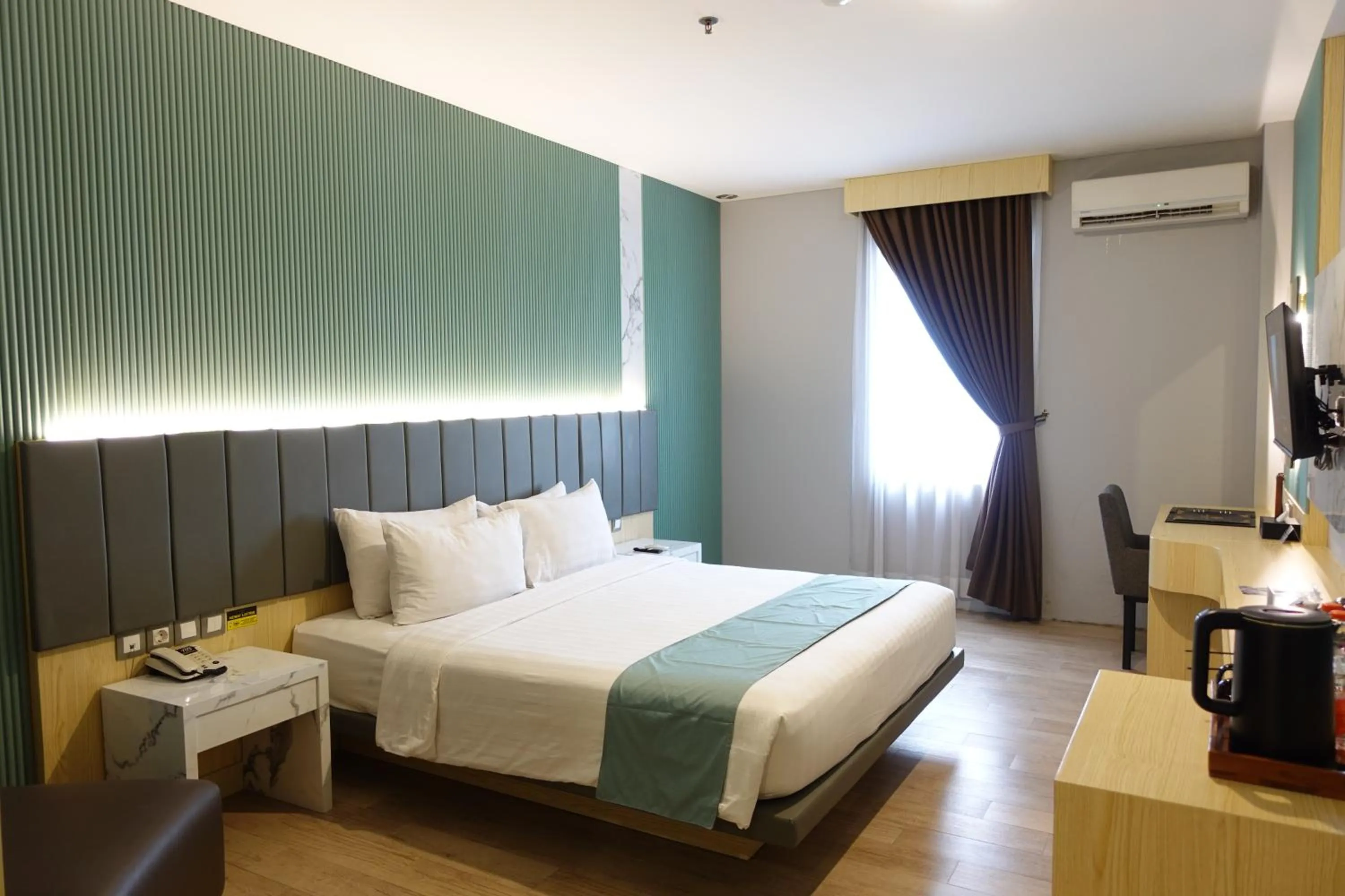 Bedroom, Bed in Grand Kangen Hotel Urip Sumoharjo