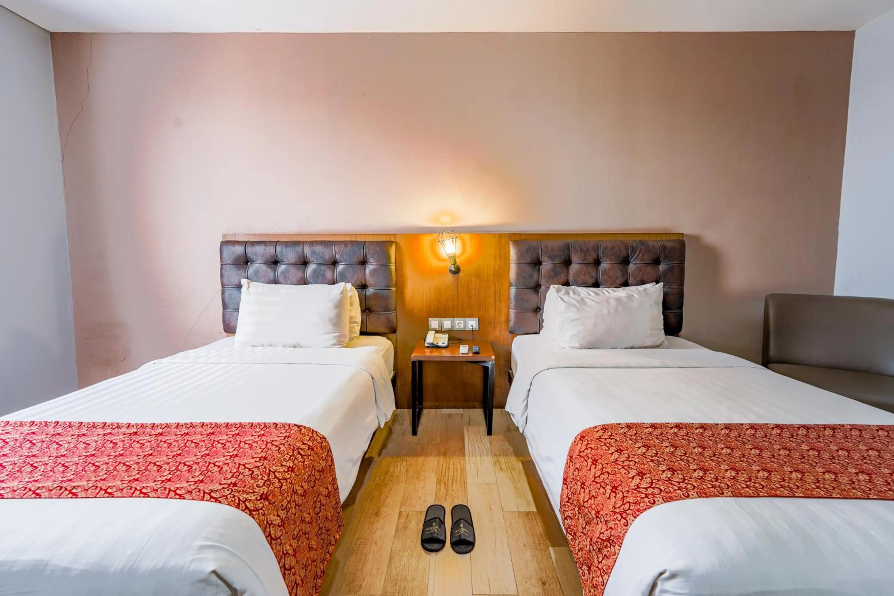 Bed in Grand Kangen Hotel Urip Sumoharjo