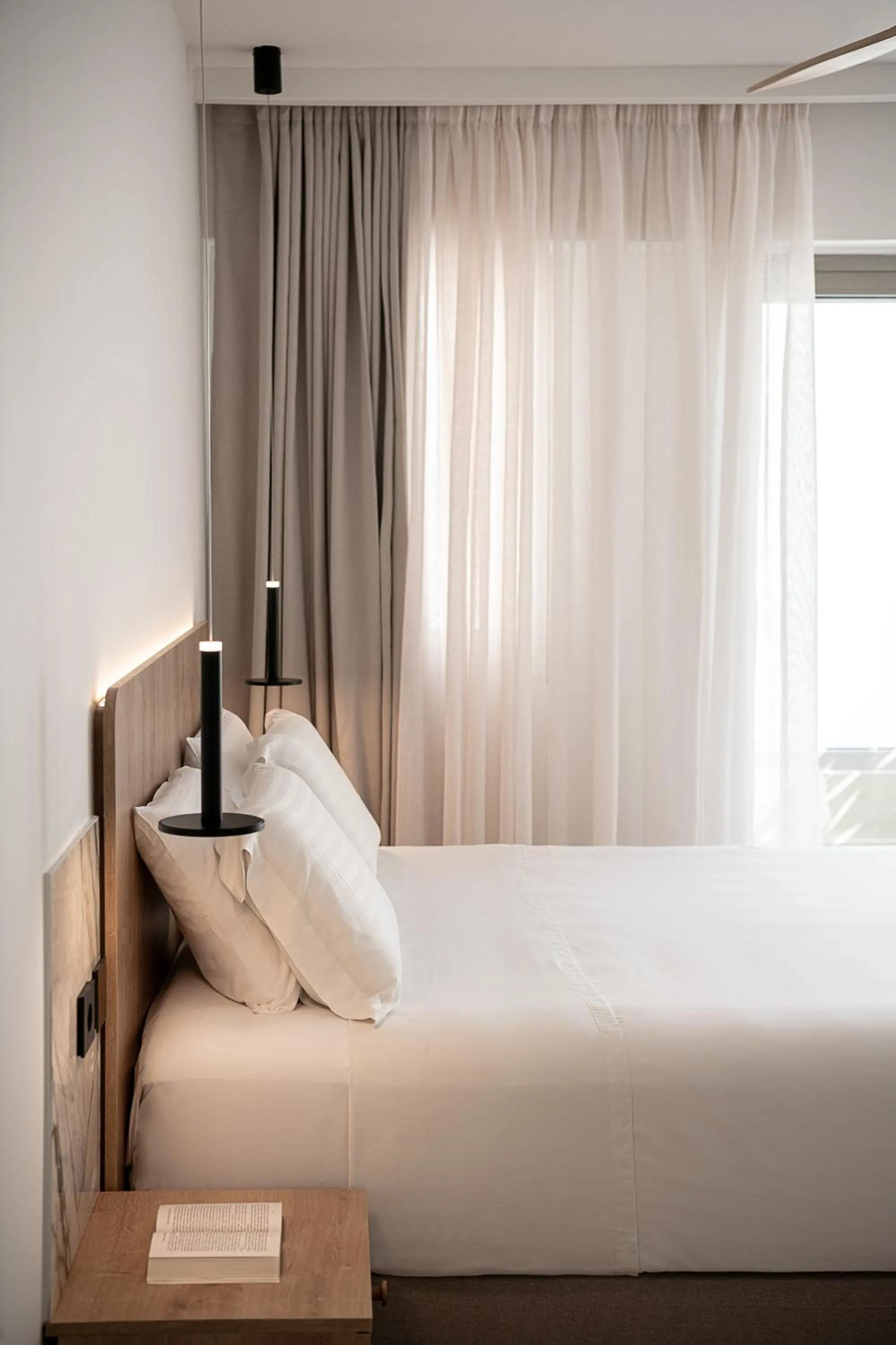 Bed in Iperion Beach Hotel