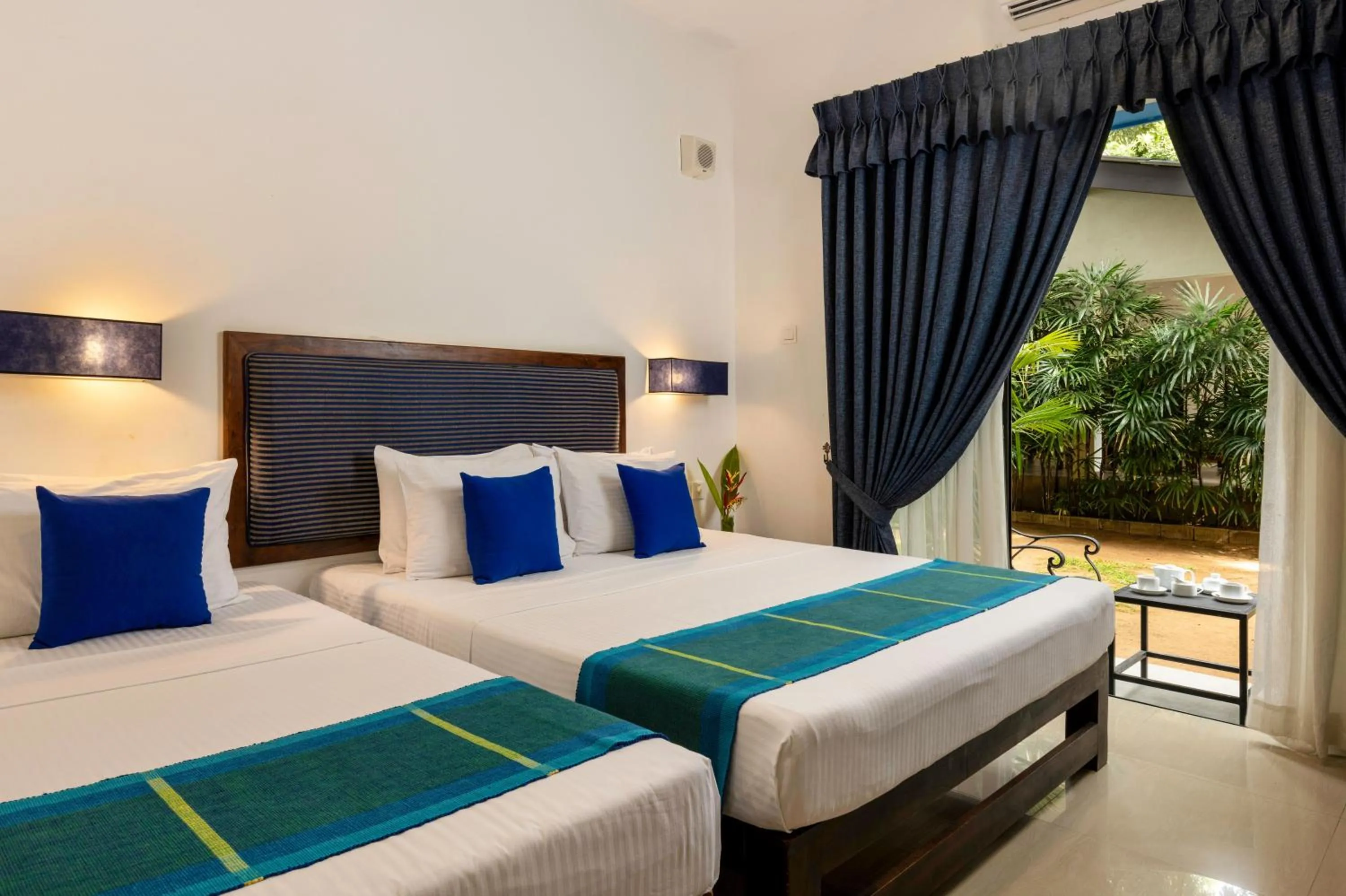 Patio, Bed in The Blue Wave Hotel