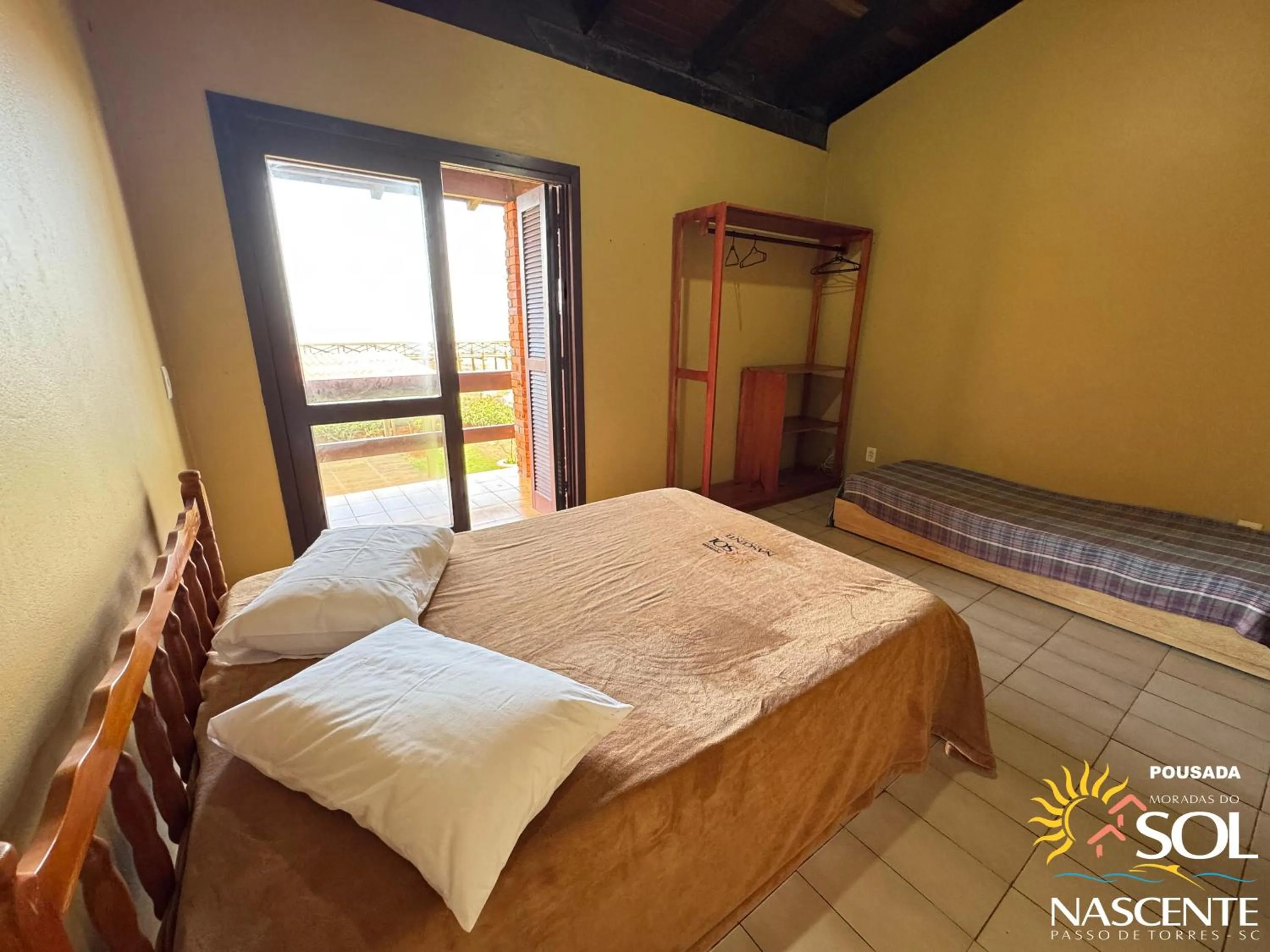 Photo of the whole room, Bed in Pousada Moradas do Sol Nascente