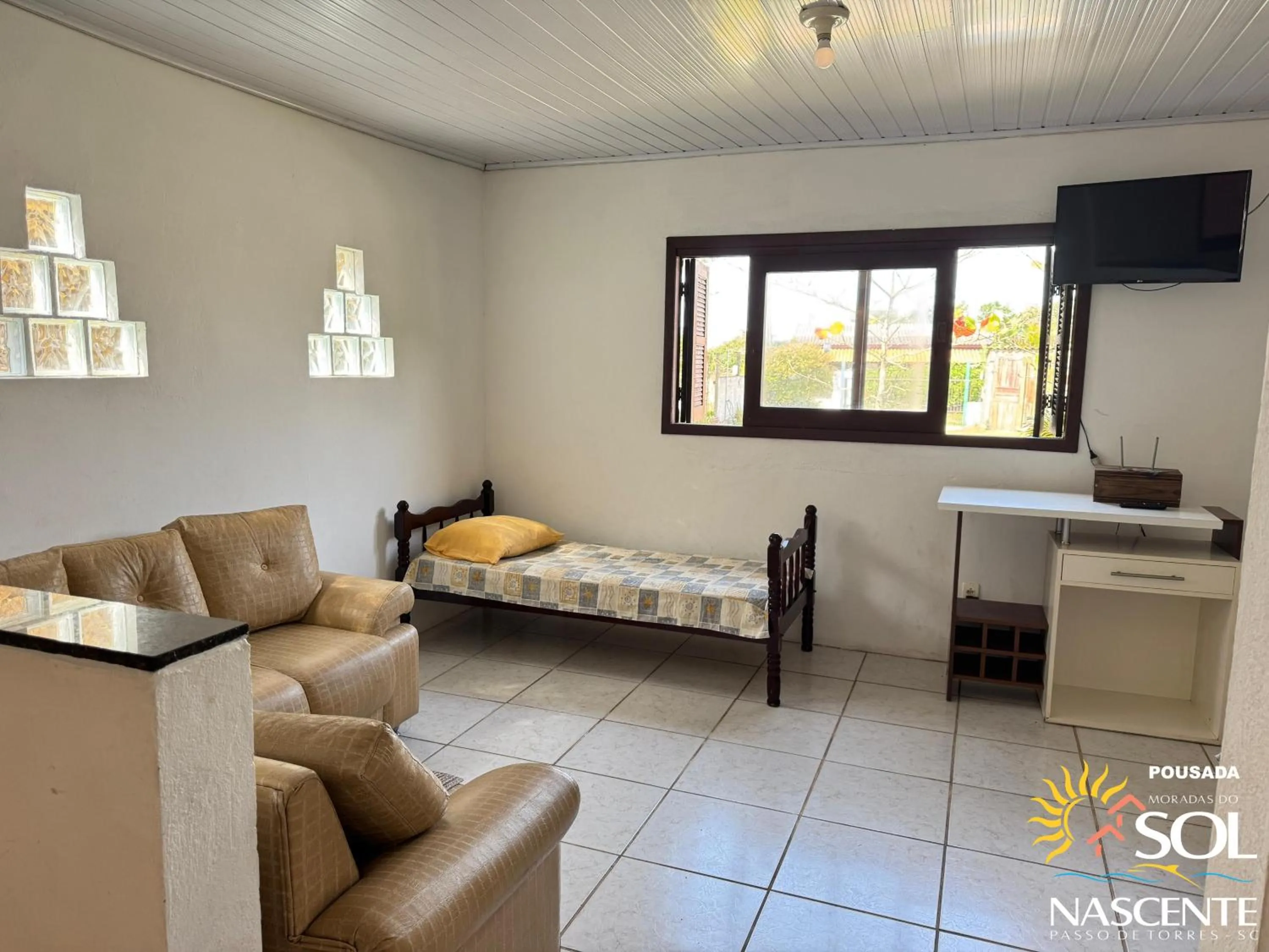 Living room, Bed in Pousada Moradas do Sol Nascente