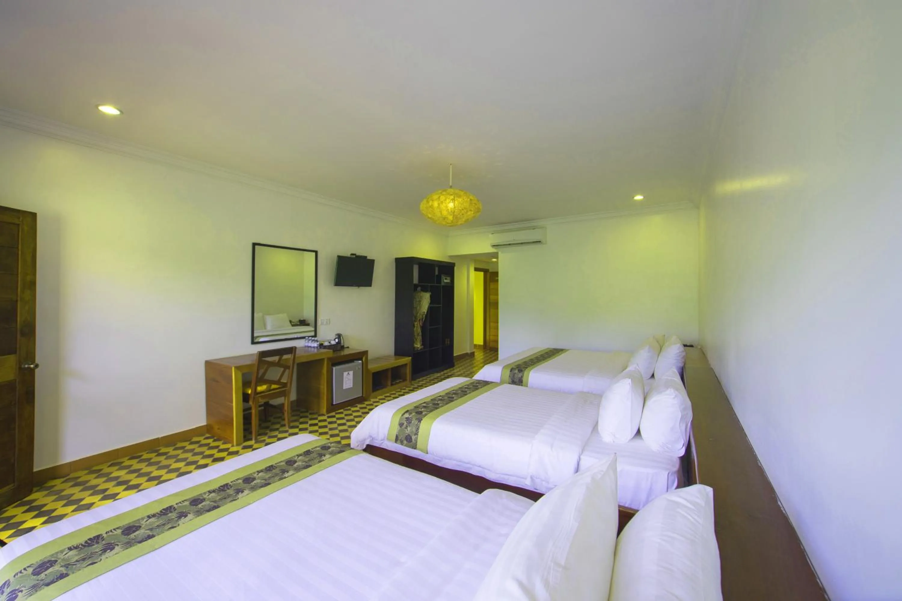 Bed in Le Jardin d'Angkor Hotel & Resort