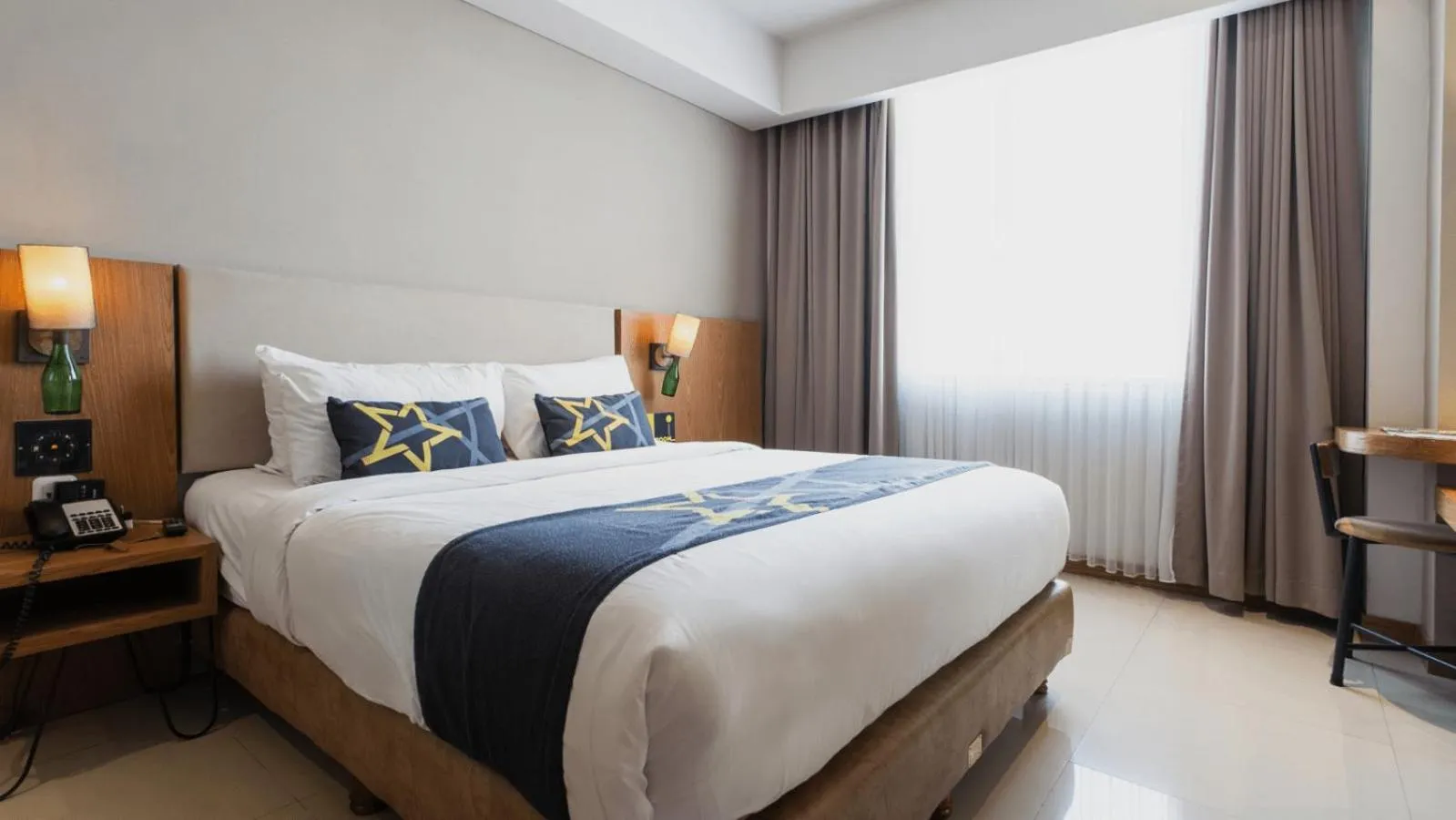 Bed in Yellow Star Ambarukmo Hotel