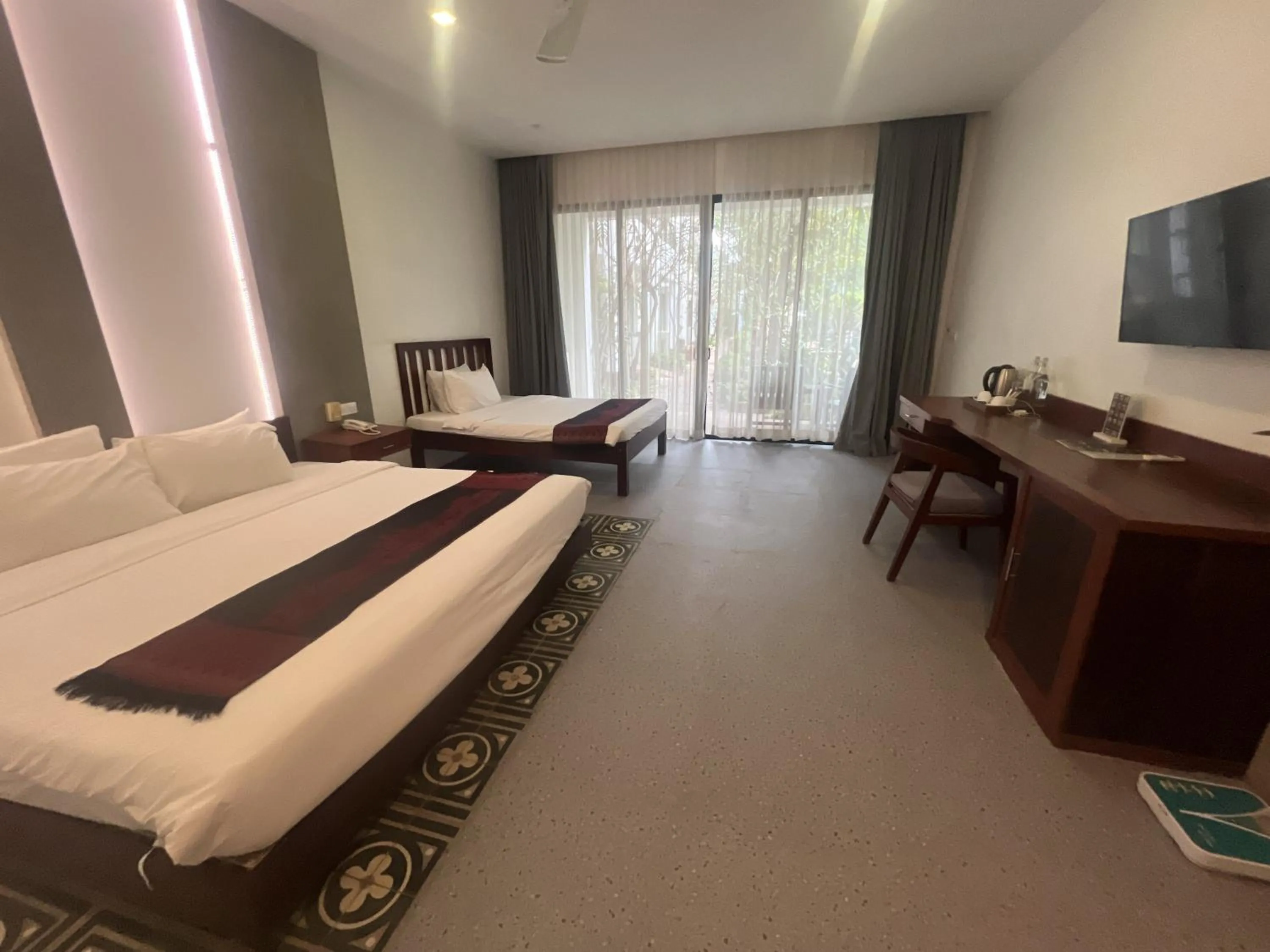 Bed in Tanei Angkor Resort and Spa