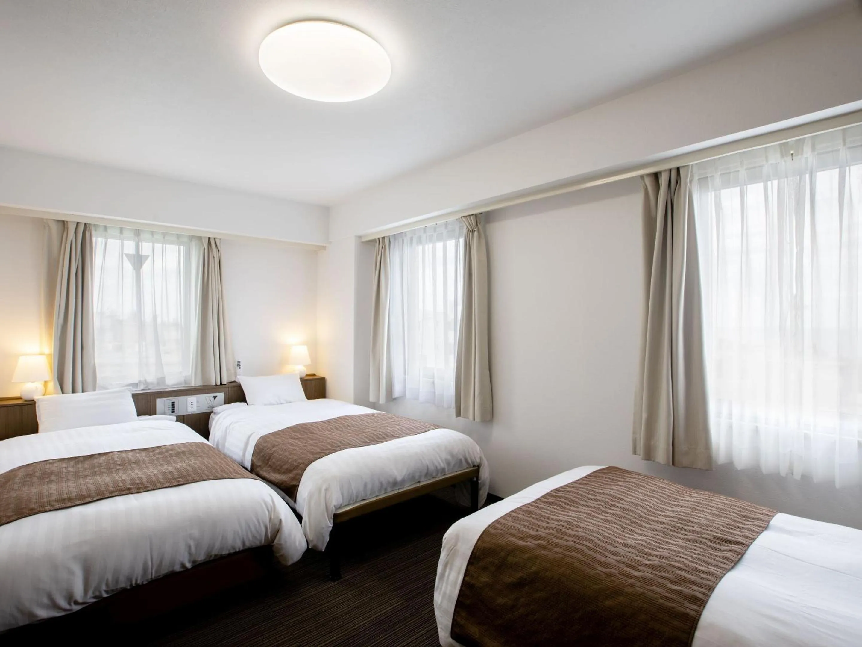 Bed in KOKO STAY Hitachi- formerly Hotel Wing International Hitachi