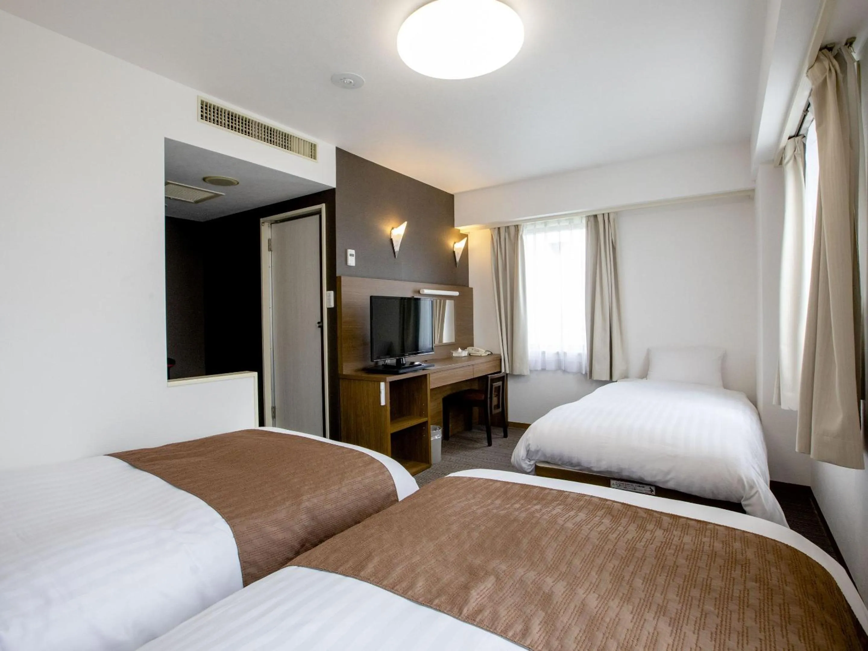 Bed in KOKO STAY Hitachi- formerly Hotel Wing International Hitachi