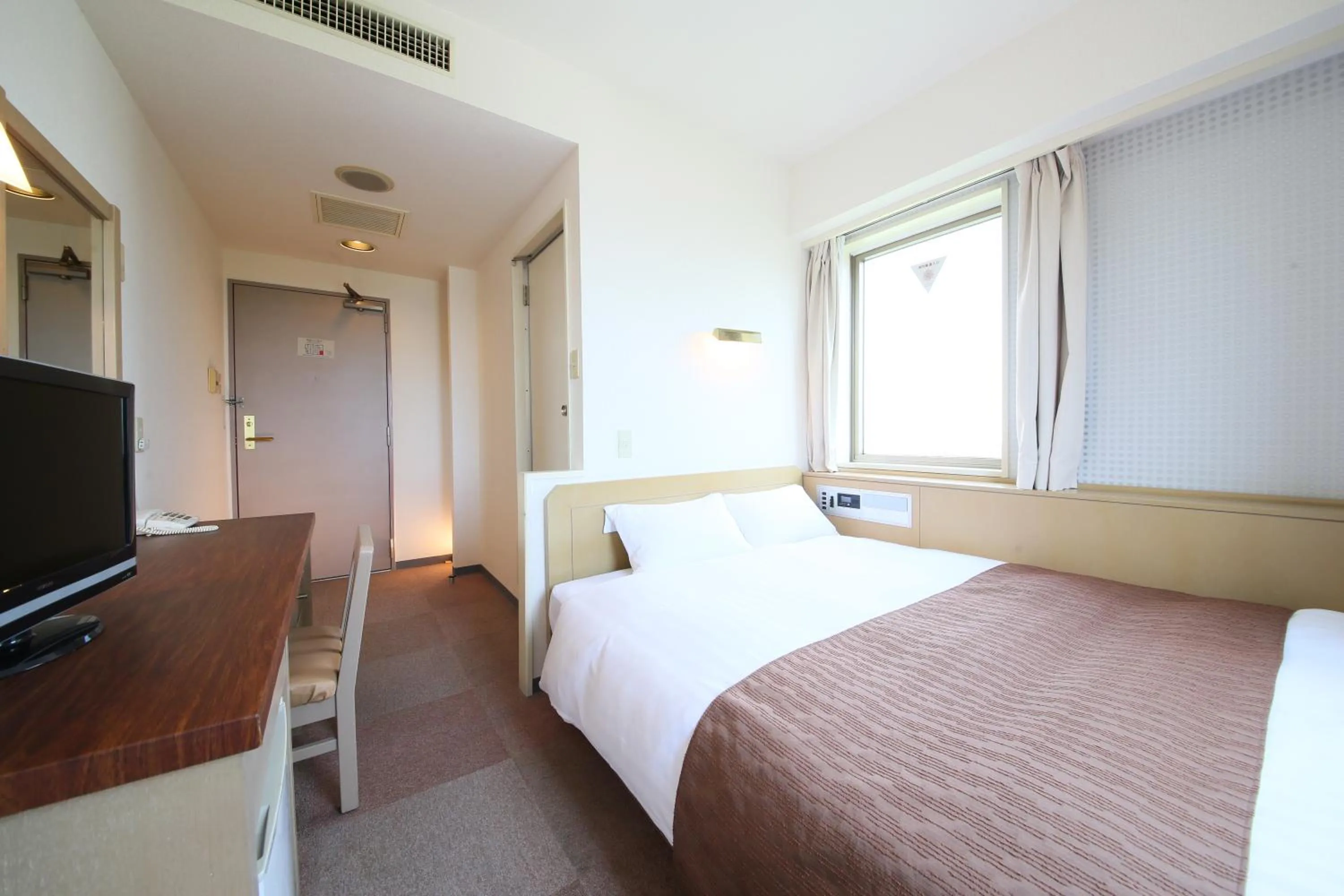 Photo of the whole room, Bed in KOKO STAY Hitachi- formerly Hotel Wing International Hitachi