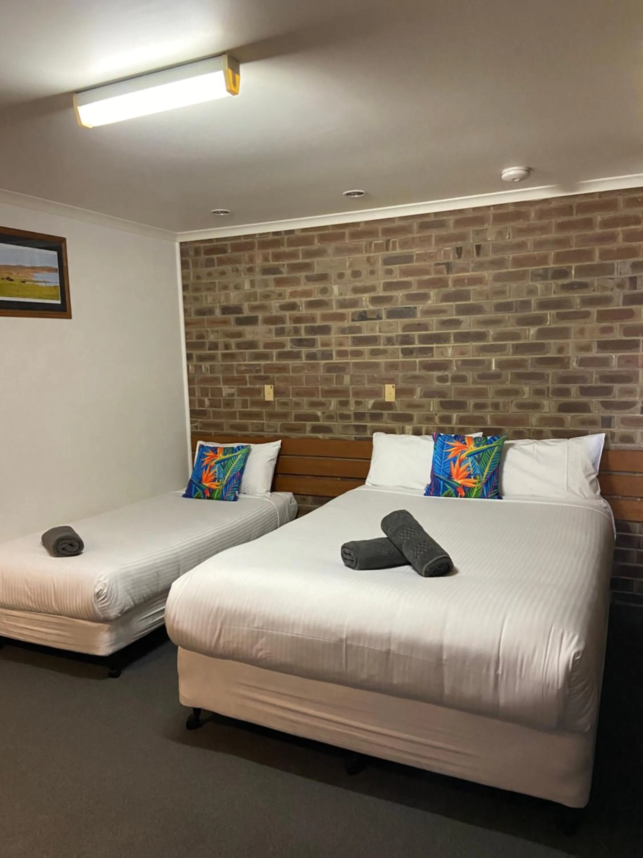 Bed in Lake Albert Motel