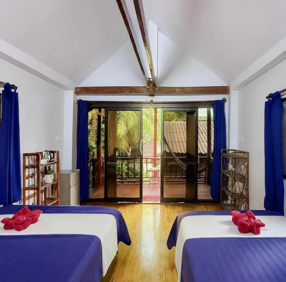 Bed in Happy Elephant Bungalows