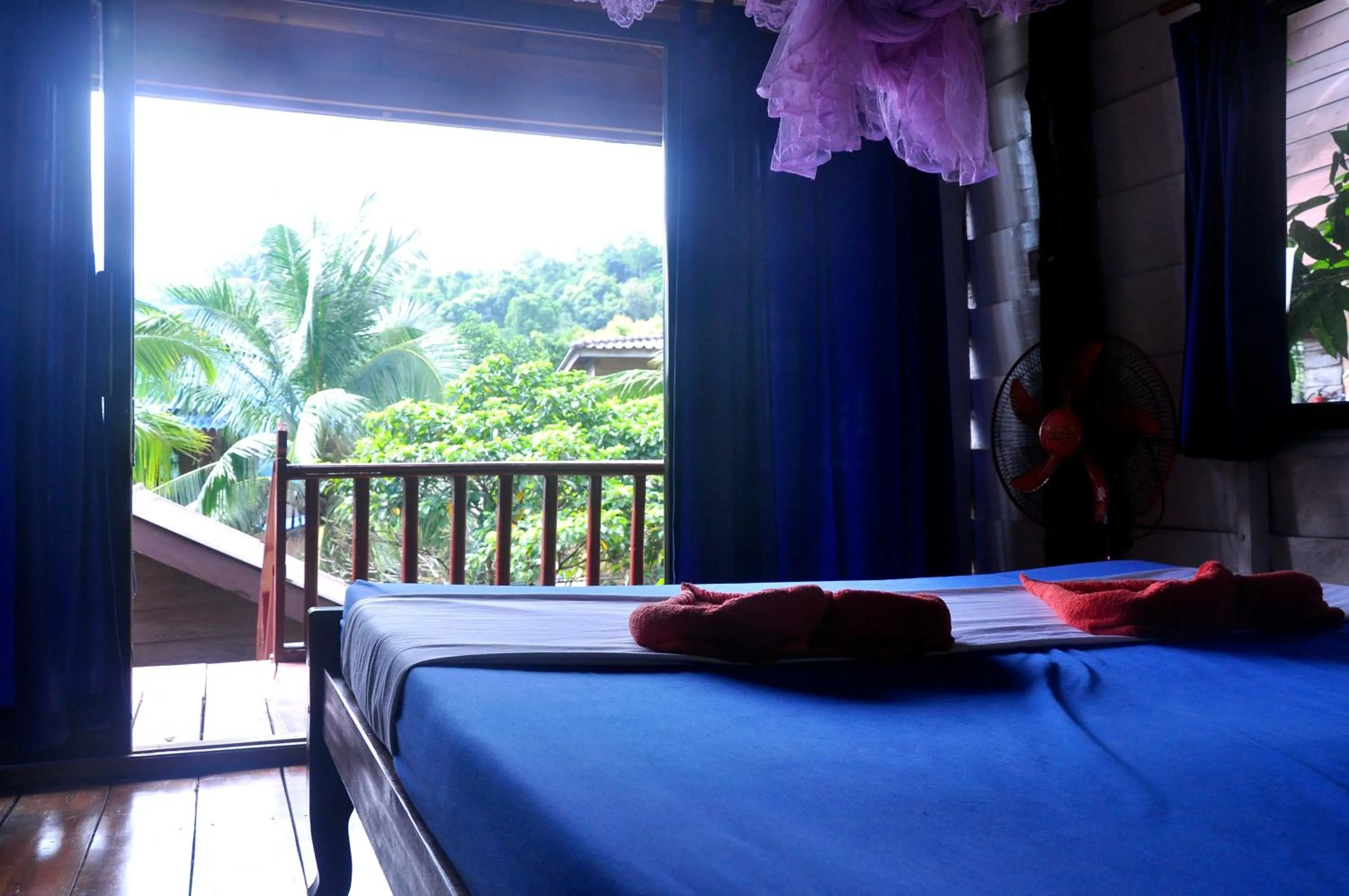View (from property/room), Bed in Happy Elephant Bungalows
