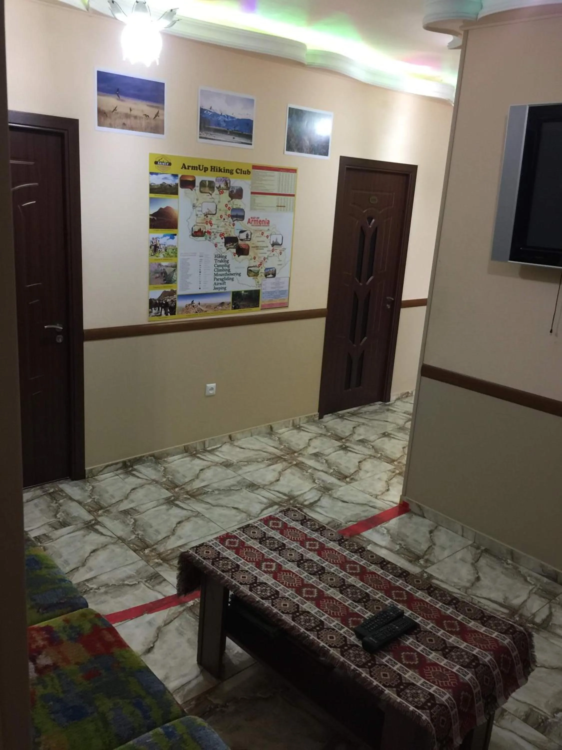 Communal lounge/ TV room, Bed in Arm Hostel