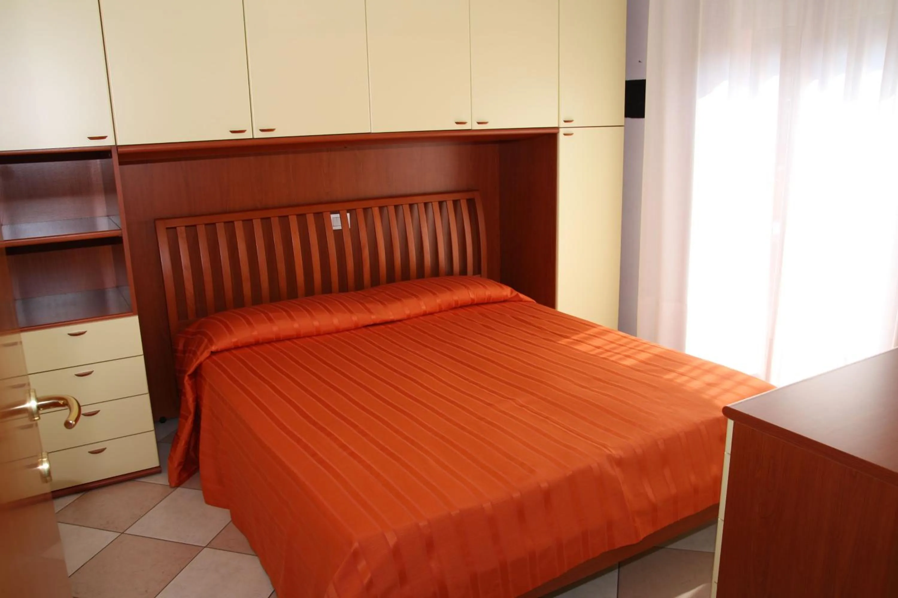 Bed in Family Apartments Residence Trieste