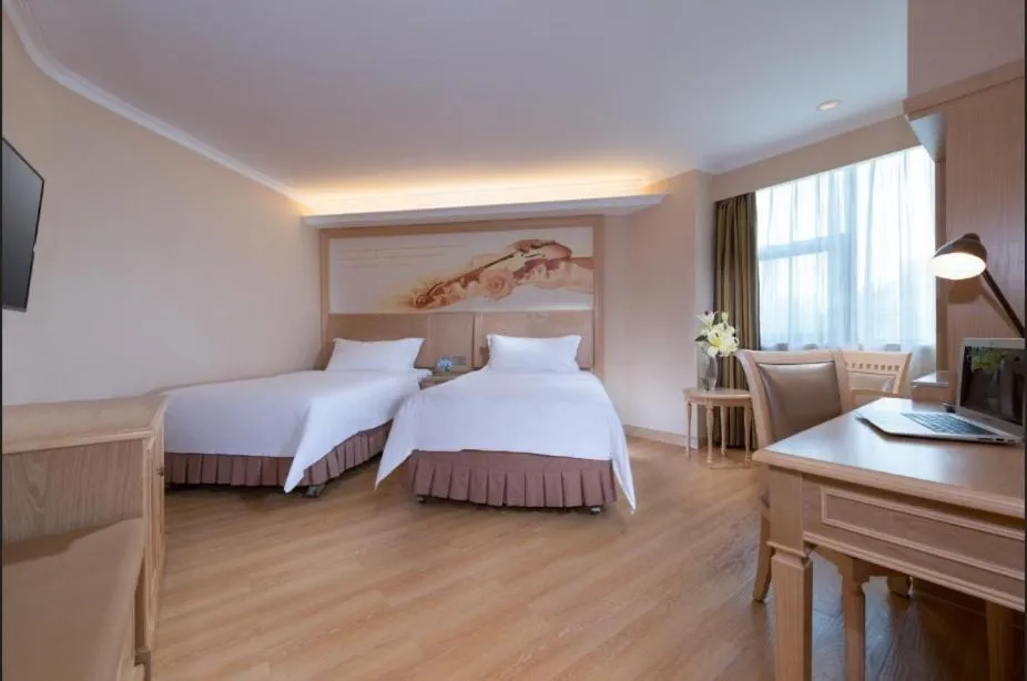 Bed in Vienna Hotel Shenzhen Haiwan
