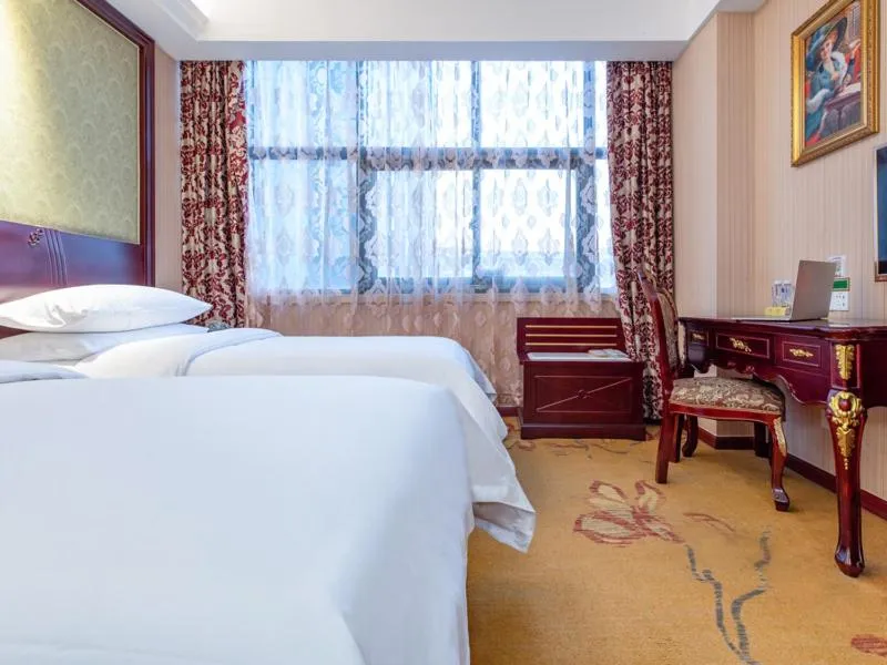 Bed in Vienna Hotel Shanghai Songjiang Wanda