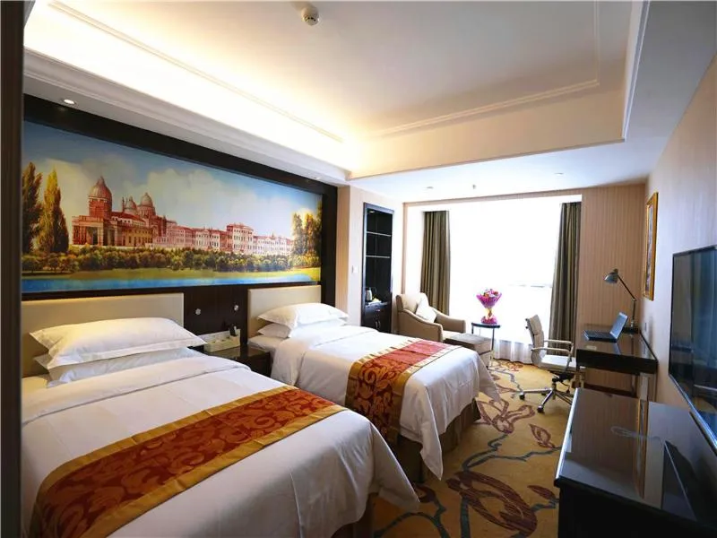 Bed in Vienna Hotel Zhumadian Huayuan Xuefu