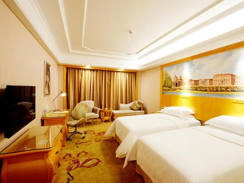 Bed in Vienna International Hotel Shenzhen Guangming Avenue