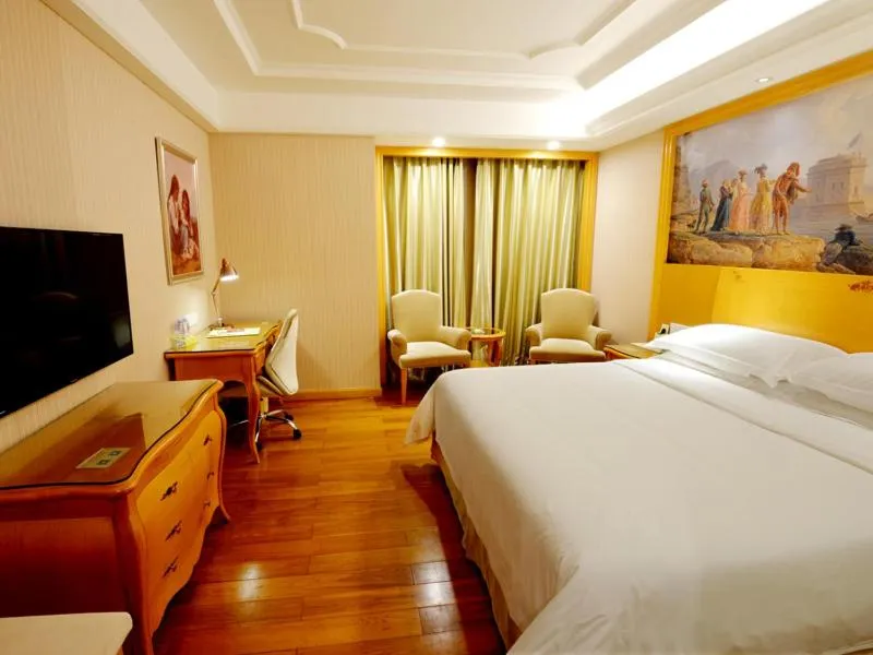 Bed in Vienna International Hotel Shenzhen Guangming Avenue