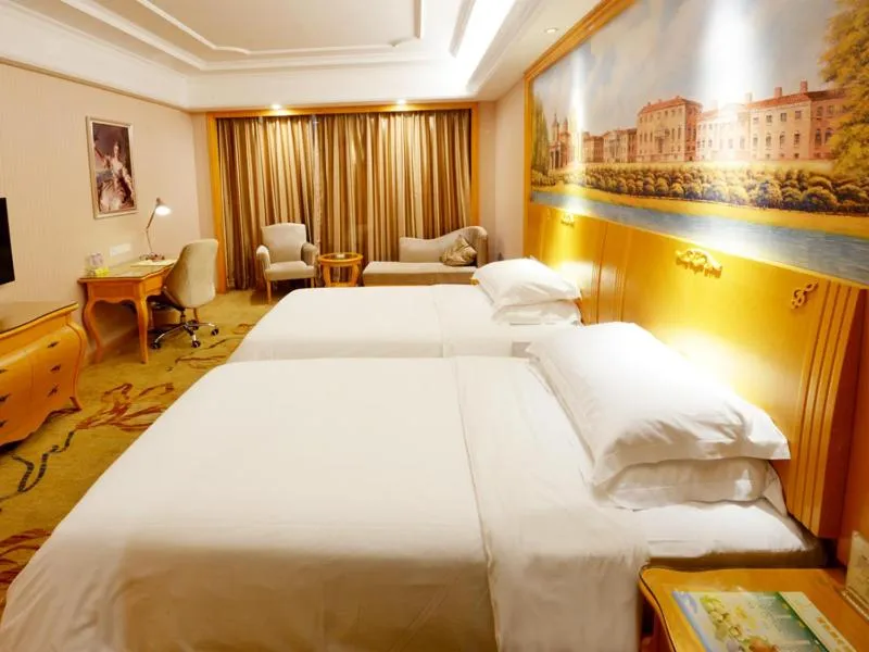 Bed in Vienna International Hotel Shenzhen Guangming Avenue