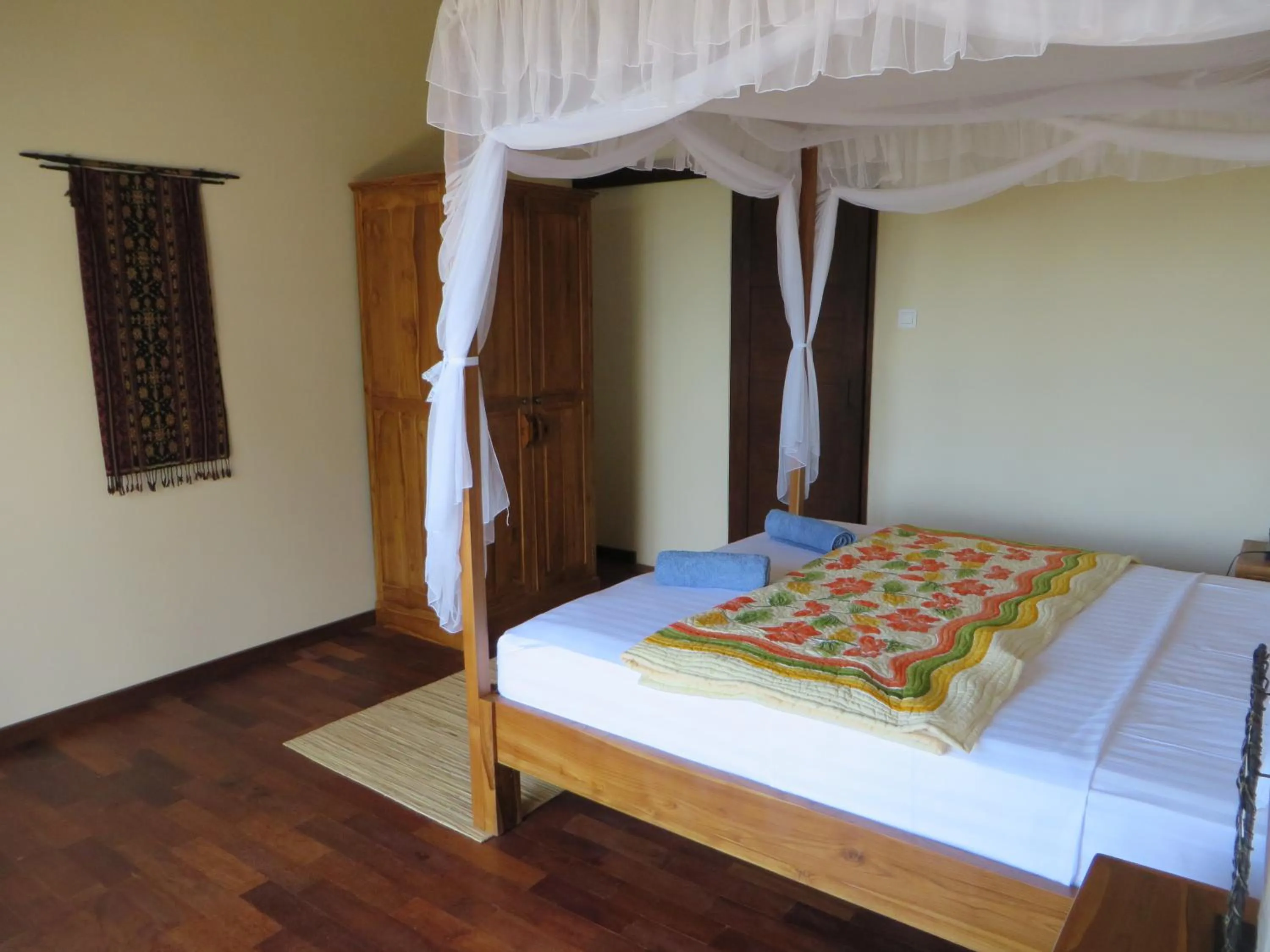 Bed in Jukung Dive Resort Bali AMED