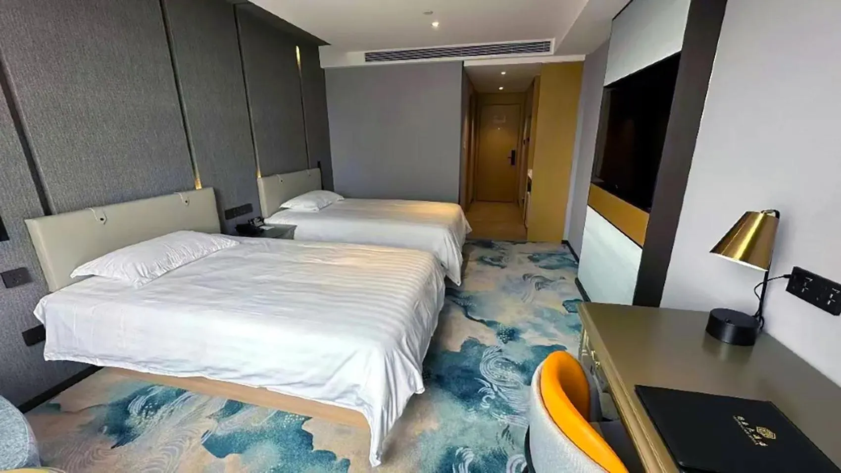 Bed in National Jade Hotel