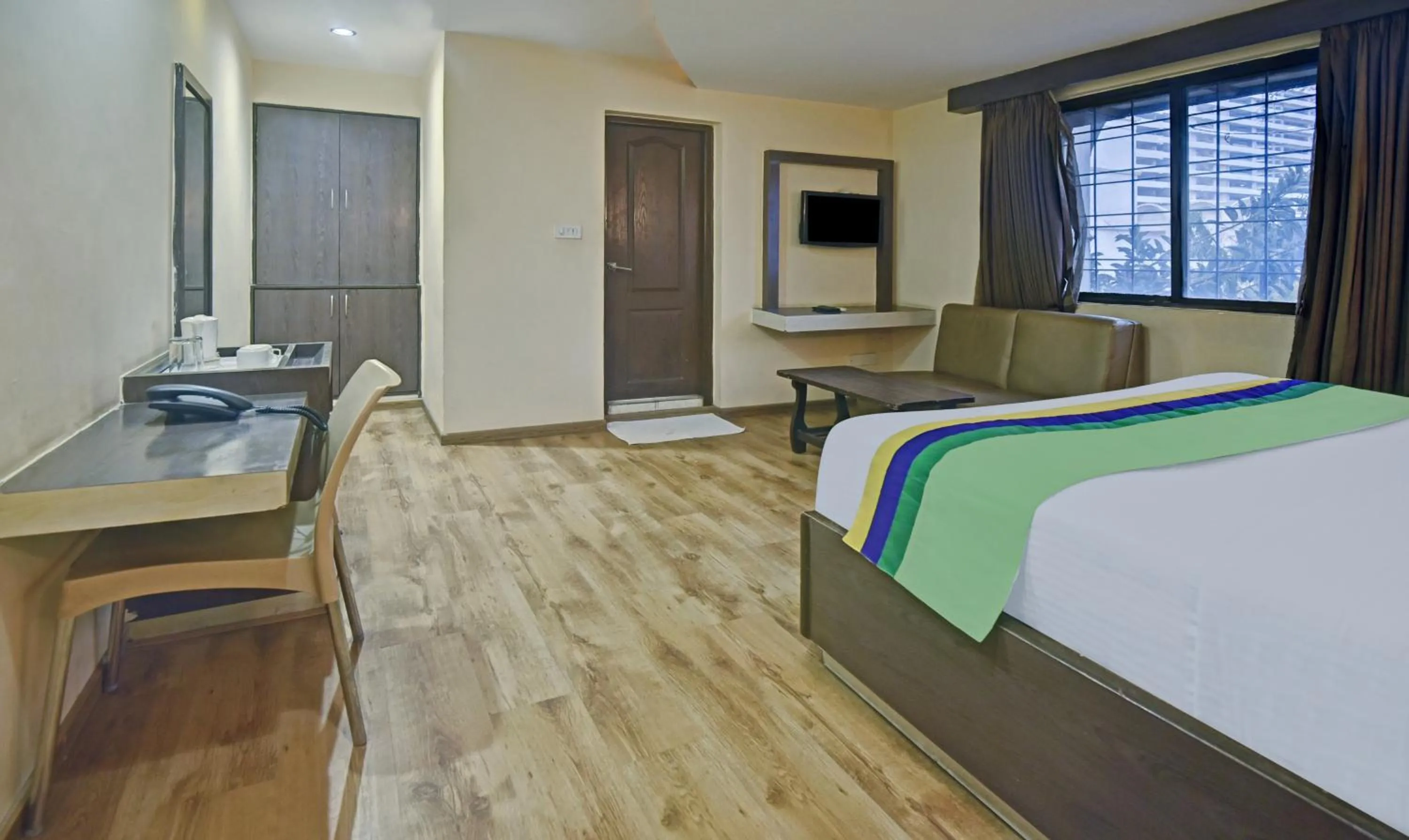 Bedroom, Bed in Treebo Savoury Sea Shell Residency