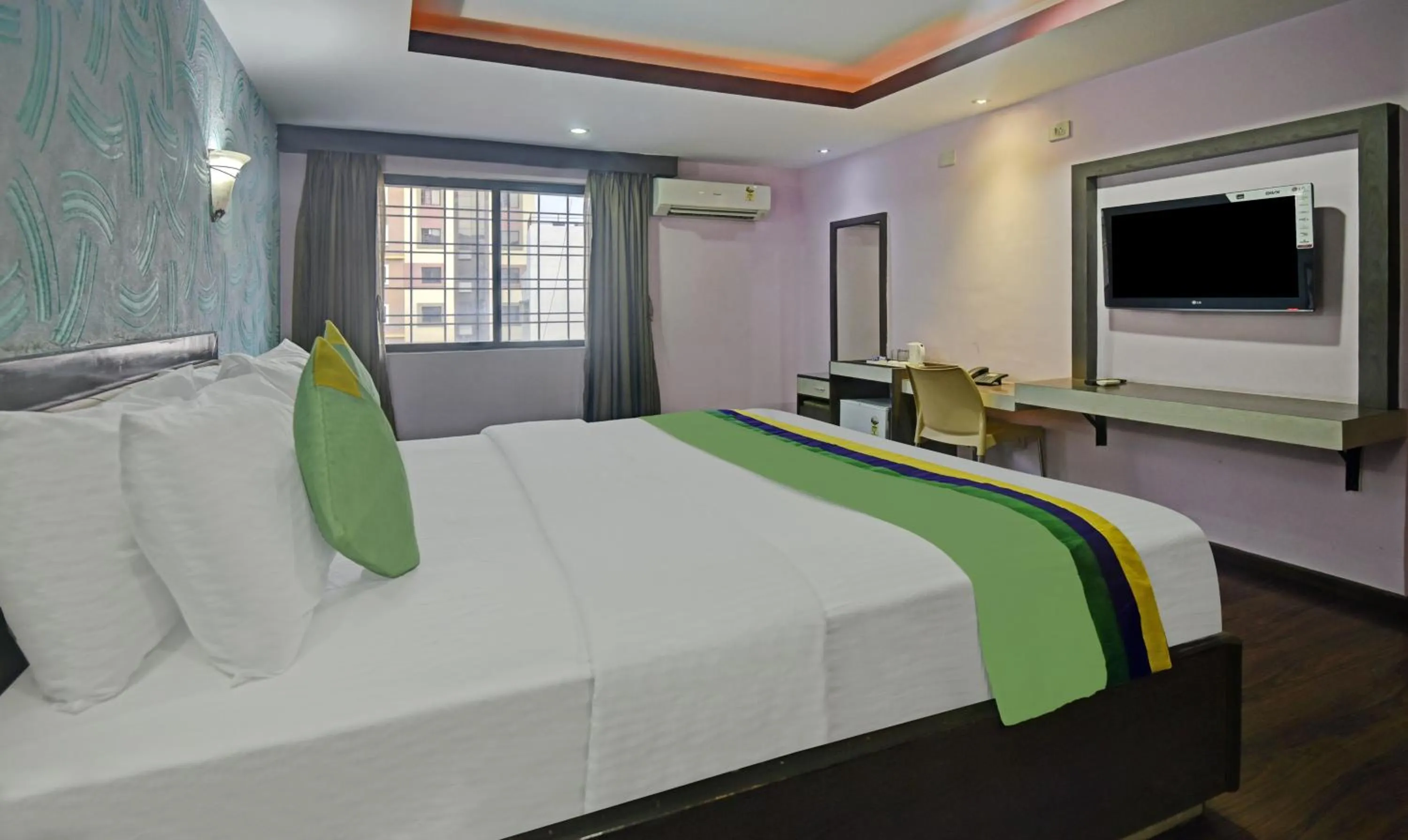 Bedroom, Bed in Treebo Savoury Sea Shell Residency