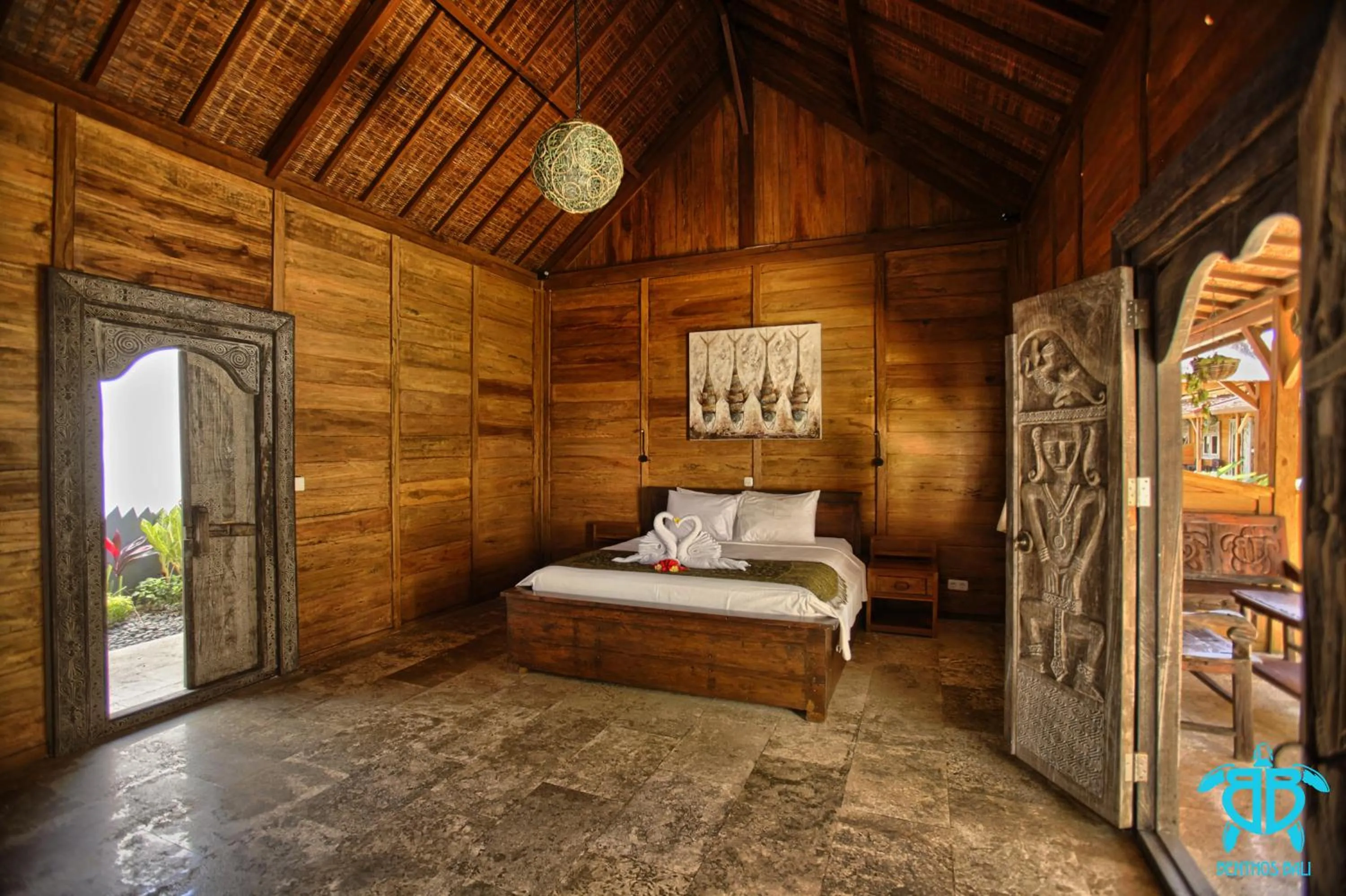 Bed in Benthos Bali Dive Resort