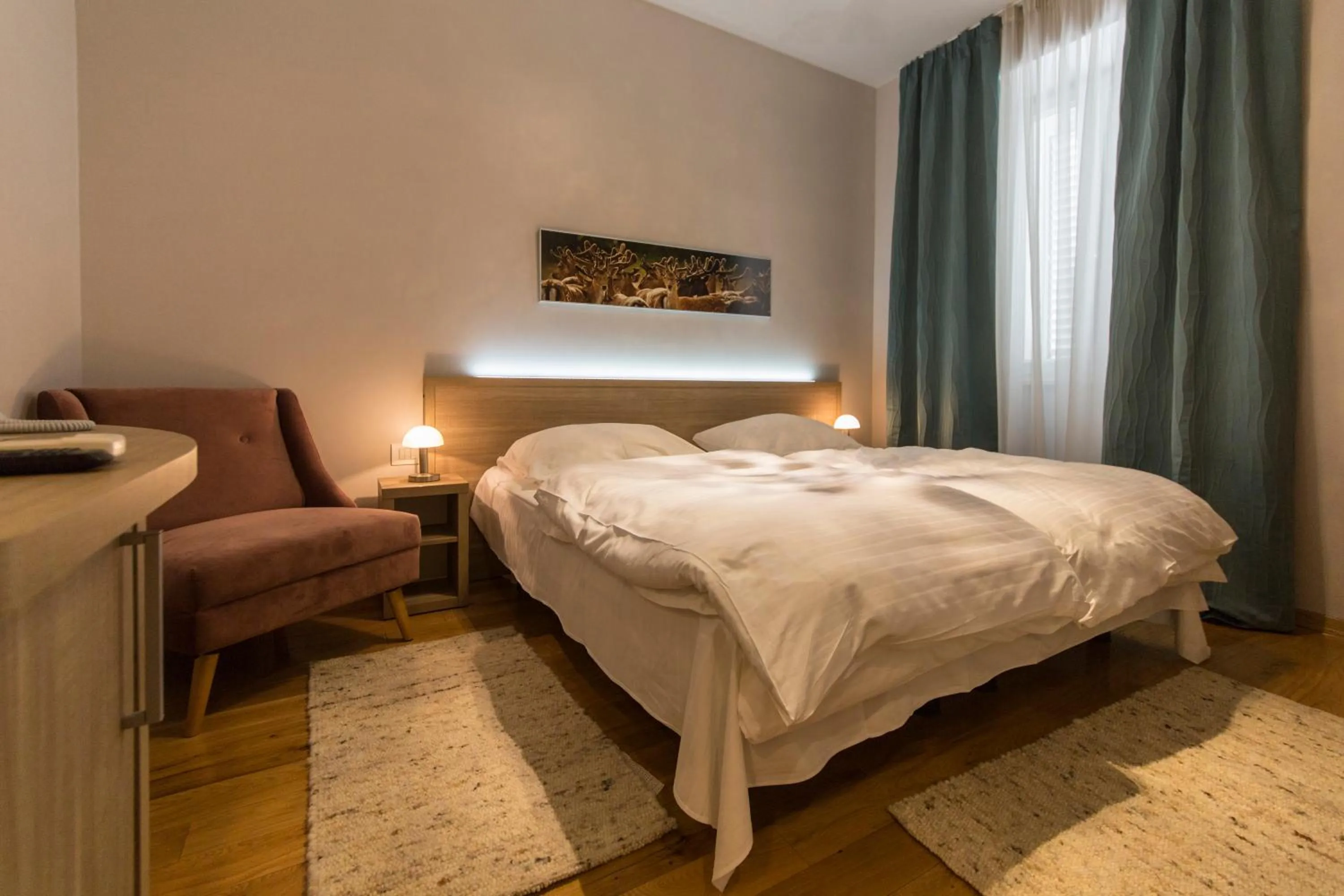 Bed in Tifani Luxury Rooms 2