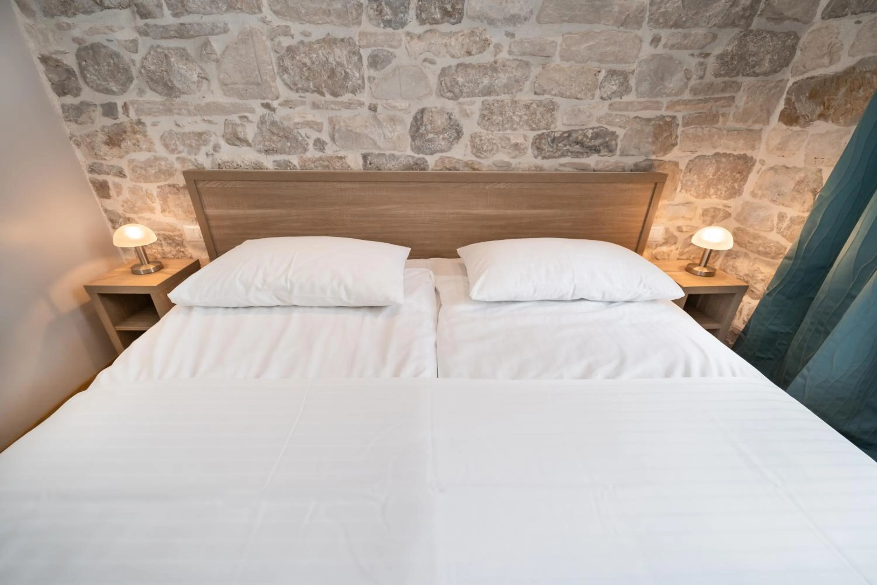 Bed in Tifani Luxury Rooms 2