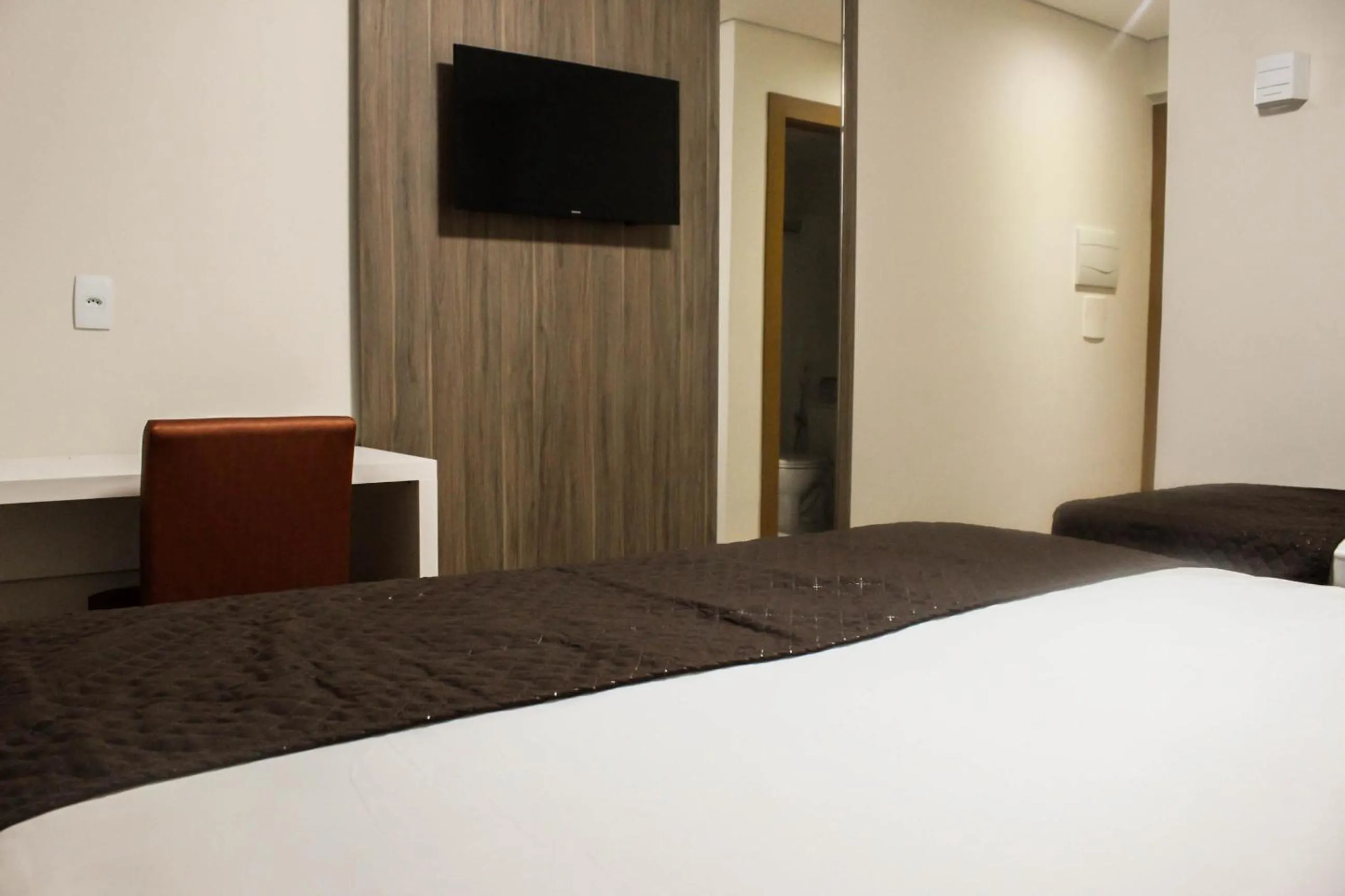 Bed in Hotel Caju de Ouro